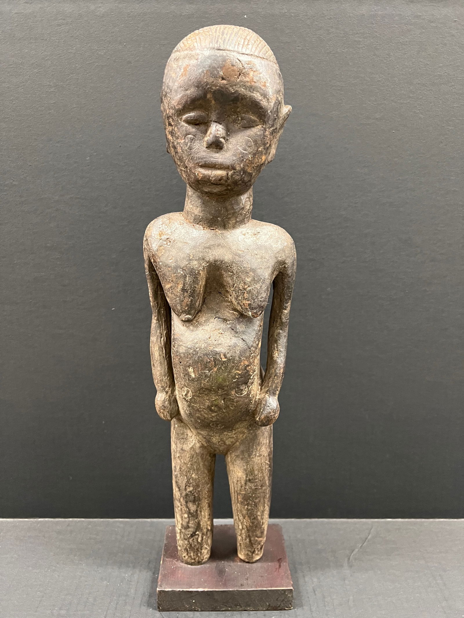 Carved Wood Bacongo Statue: African Tribal Art Carved Wood Bacongo Statue. The dimension is 21.5 inches high x 5.75 inches wide. Please be aware that some of the items are vintage, secondhand, old ages, antiques and may have a d