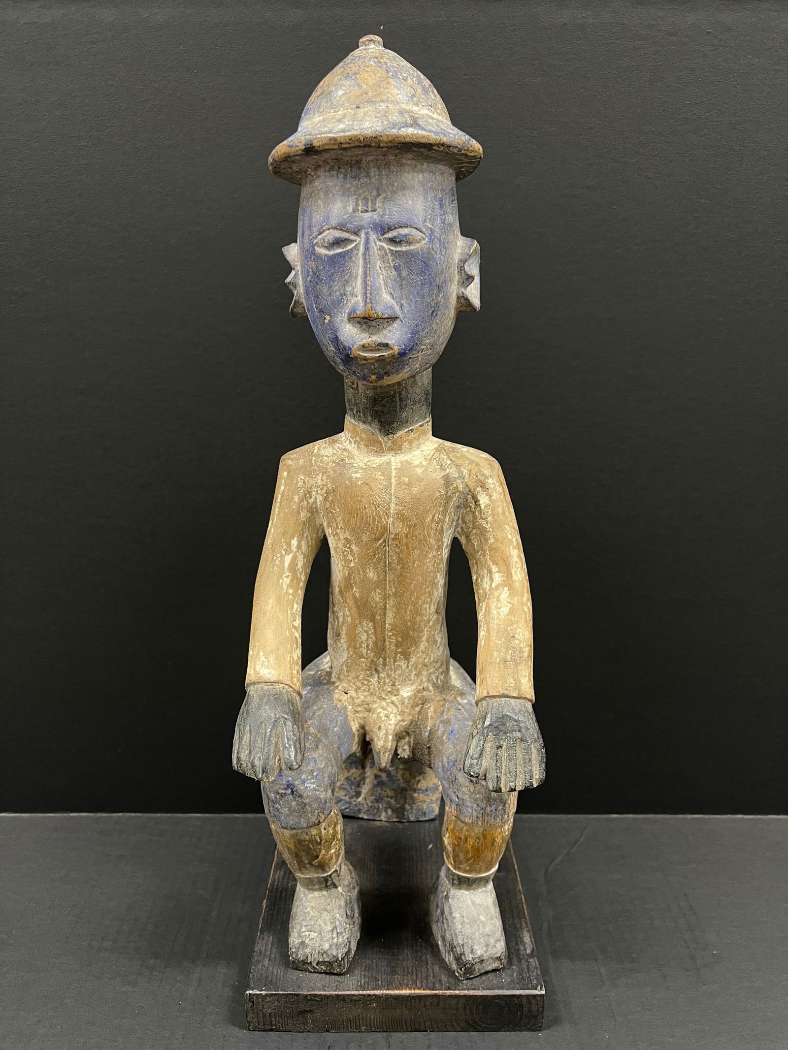 Carved Wood Colonial Statue: African Tribal Art Carved Wood Colonial Statue. The dimension is 22 inches high x 8 inches wide. Please be aware that some of the items are vintage, secondhand, old ages, antiques and may have a defec