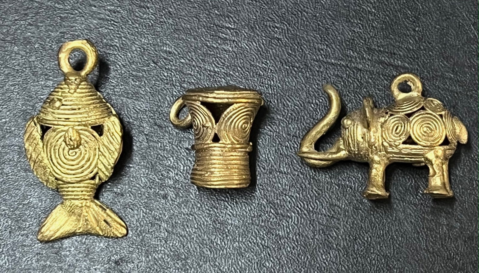 Ashanti Brass Pendant Set of 3: African Tribal Art Ashanti Brass Pendant Set of 3. The dimension is 1.5 inches high x 1.5 inches wide. Please be aware that some of the items are vintage, secondhand, old ages, antiques and may have a