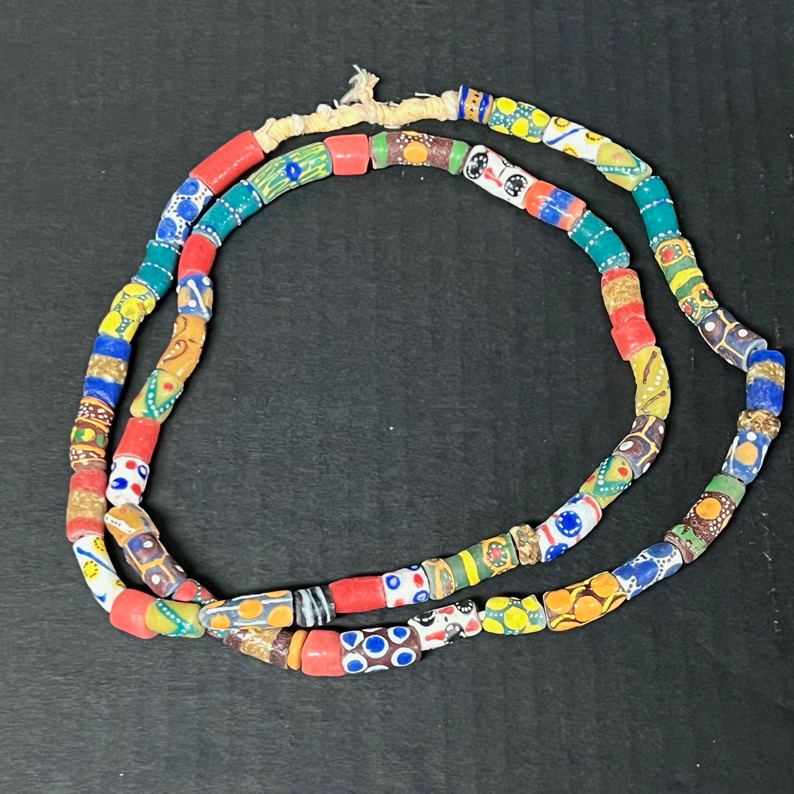 African Art Glass Beads Necklace: African Tribal Art Glass Beads Necklace. The dimension is 40 inches round. Please be aware that some of the items are vintage, secondhand, old ages, antiques and may have a defects or sign of ages, Ho