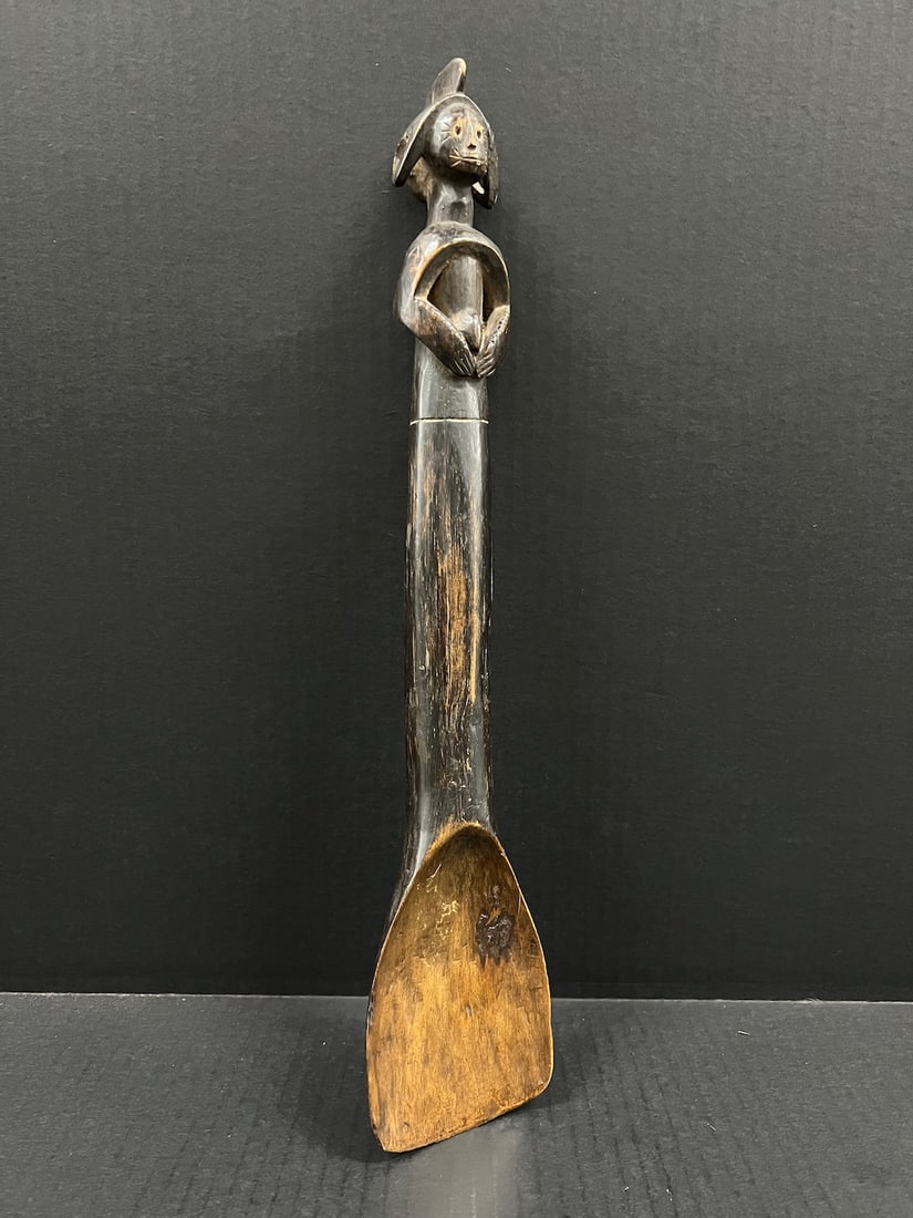 African Art Carved Wood Mumuye Spoon: African Tribal Art Carved Wood Mumuye Spoon. The dimension is 17 inches high x 3.5 inches wide. Please be aware that some of the items are vintage, secondhand, old ages, antiques and may have a defect