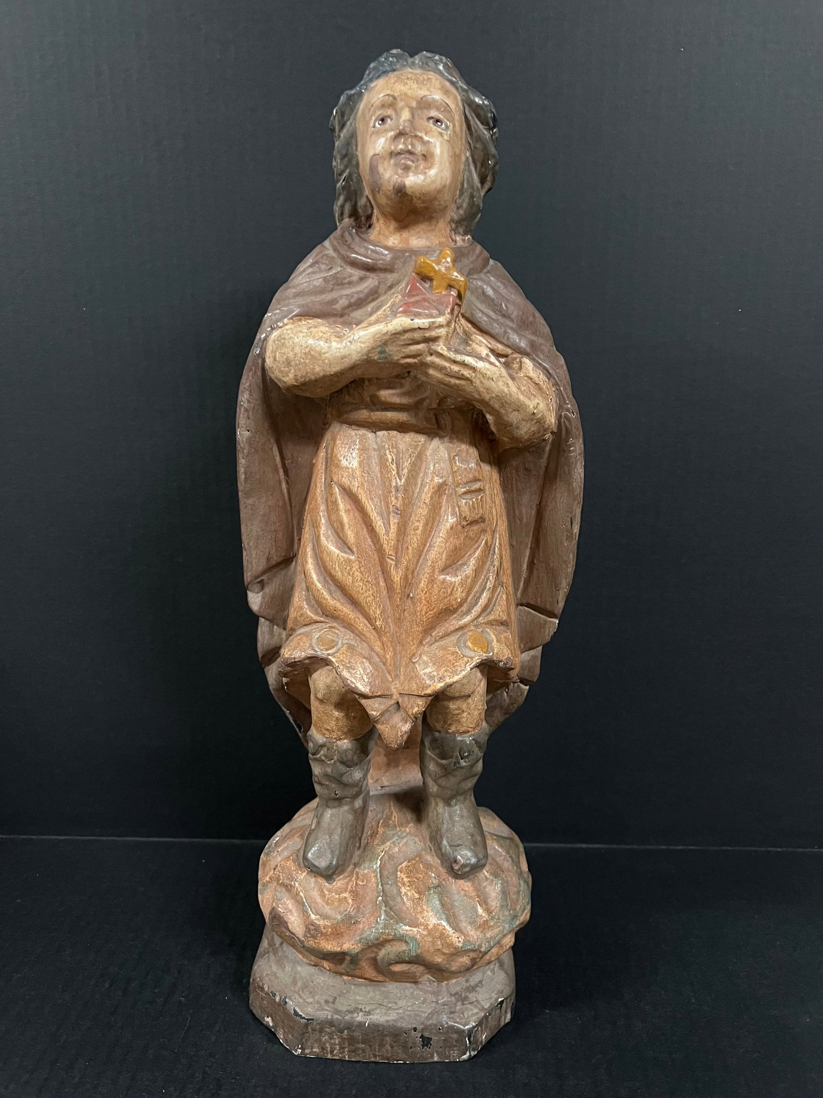 Carved Wood Archangel: Religious Art Carved Wood Archangel. The dimension is 18 inches high x 7 inches wide. Please be aware that some of the items are vintage, secondhand, old ages, antiques and may have a defects or sign
