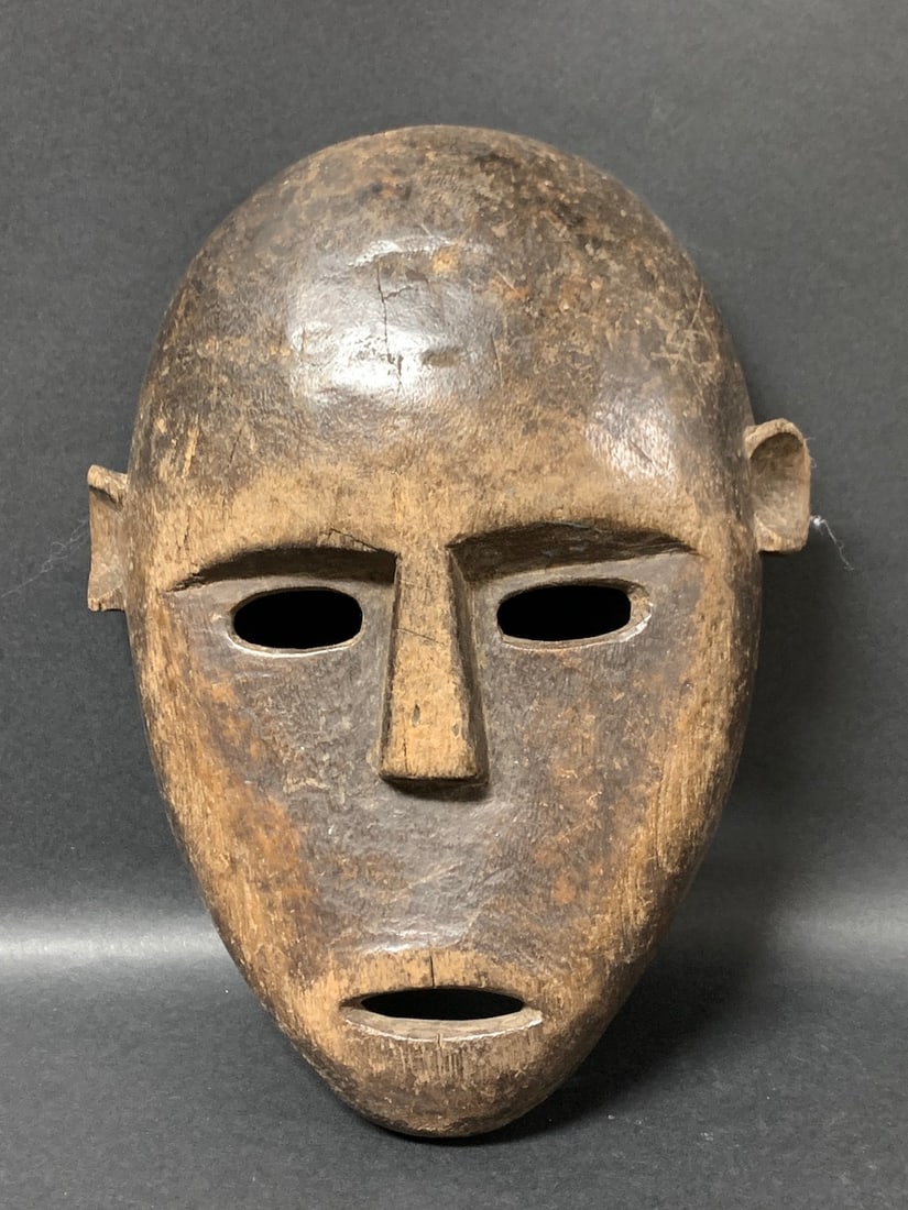Dan Mask: African Tribal Art Dan Mask. The dimension is 10 inches high x 7 inches wide. Please be aware that some of the items are vintage, secondhand, old ages, antiques and may have a defects or sign of ages,