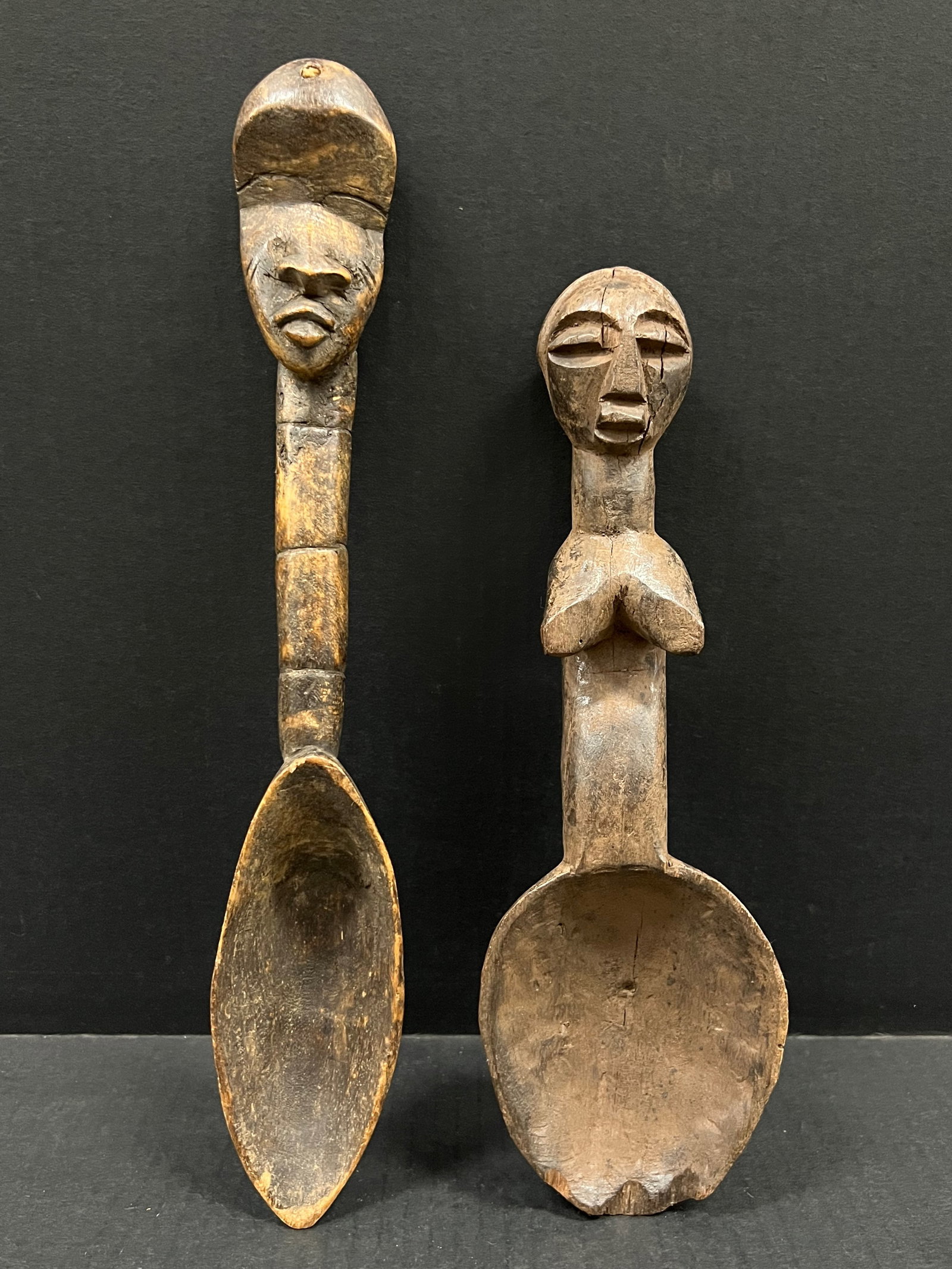 Carved Wood Dan Spoon lot of 2: African Tribal Art Carved Wood Dan Spoon Lot of 2. The dimension is 12 inches high x 4 inches wide. Please be aware that some of the items are vintage, secondhand, old ages, antiques and may have a de