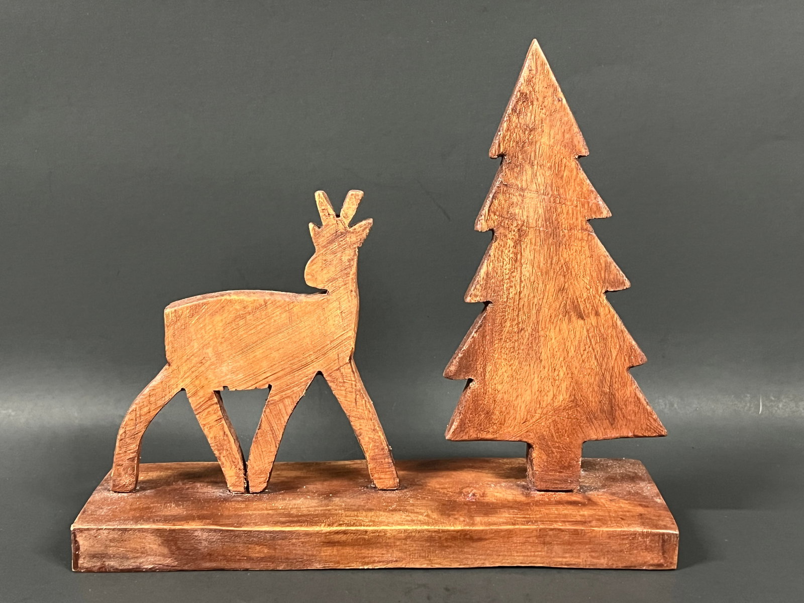 Carved Wood Christmas Tree and Deer Sculpture: Folk Art Carved Wood Christmas Tree and Deer Sculpture. The dimension is 8 inches high x 8 inches wide. Please be aware that some of the items are vintage, secondhand, old ages, antiques and may have
