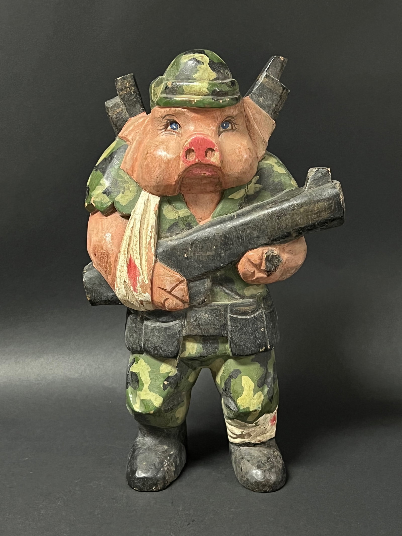 Folk Art Painted Carved Wood Pig Soldier Sculpture: Folk Art Painted Carved Wood Pig Soldier Sculpture. The dimension is 12.5 inches high x 7.5 inches wide. Please be aware that some of the items are vintage, secondhand, old ages, antiques and may have
