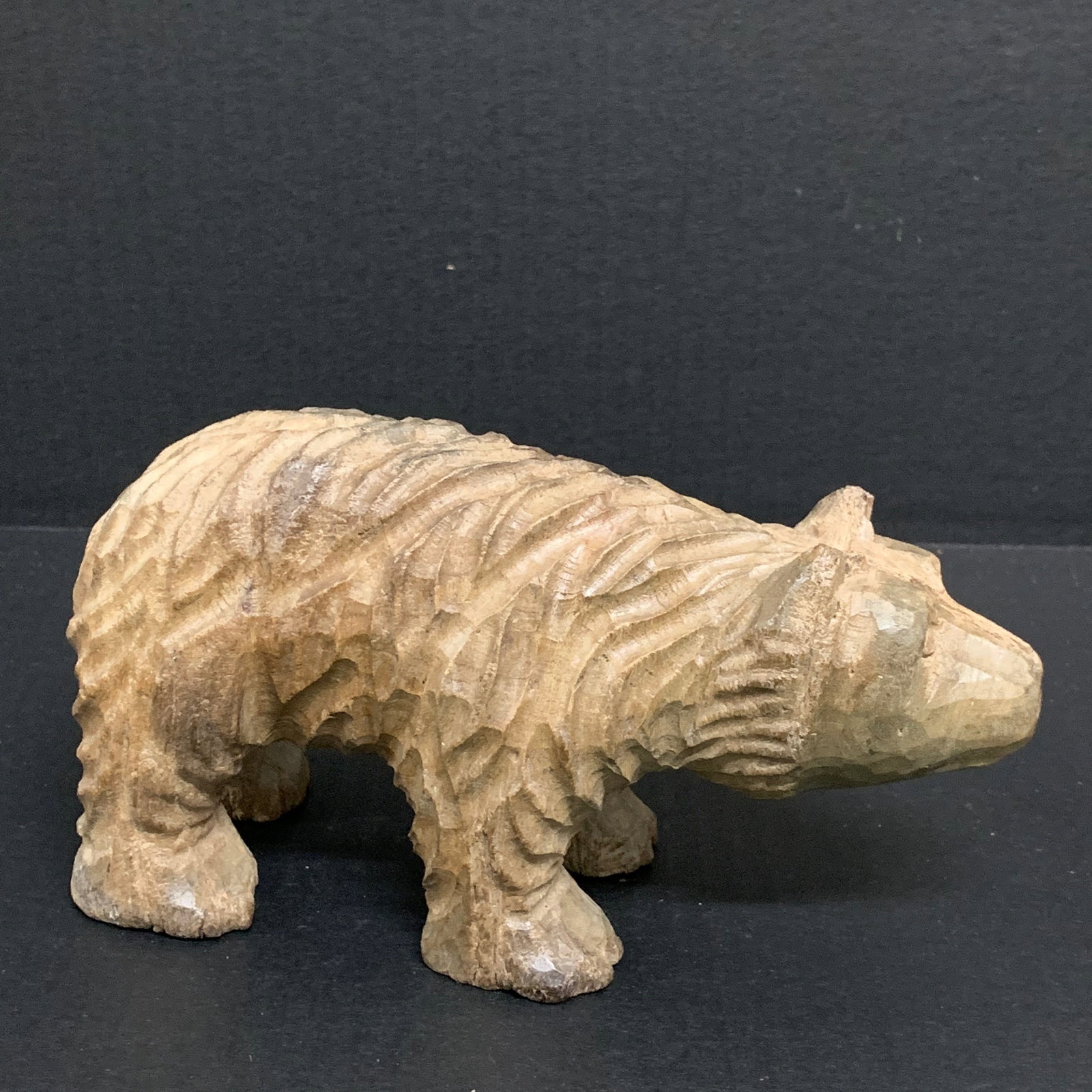 Folk Art Carved Wood Bear Sculpture: Folk Art Carved Wood Bear Sculpture. The dimension is 4.5 inches high x 8 inches wide. Please be aware that some of the items are vintage, secondhand, old ages, antiques and may have a defects or
