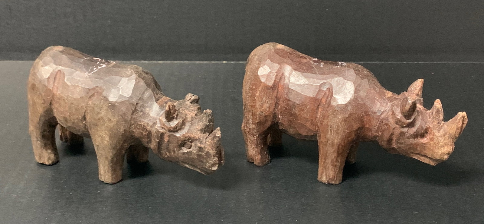 Carved Wood Rhinosaurus Sculpture: Folk Art Carved Wood Rhinosaurus Sculpture. The dimension is 3 inches high x 5 inches wide. Please be aware that some of the items are vintage, secondhand, old ages, antiques and may have a defects