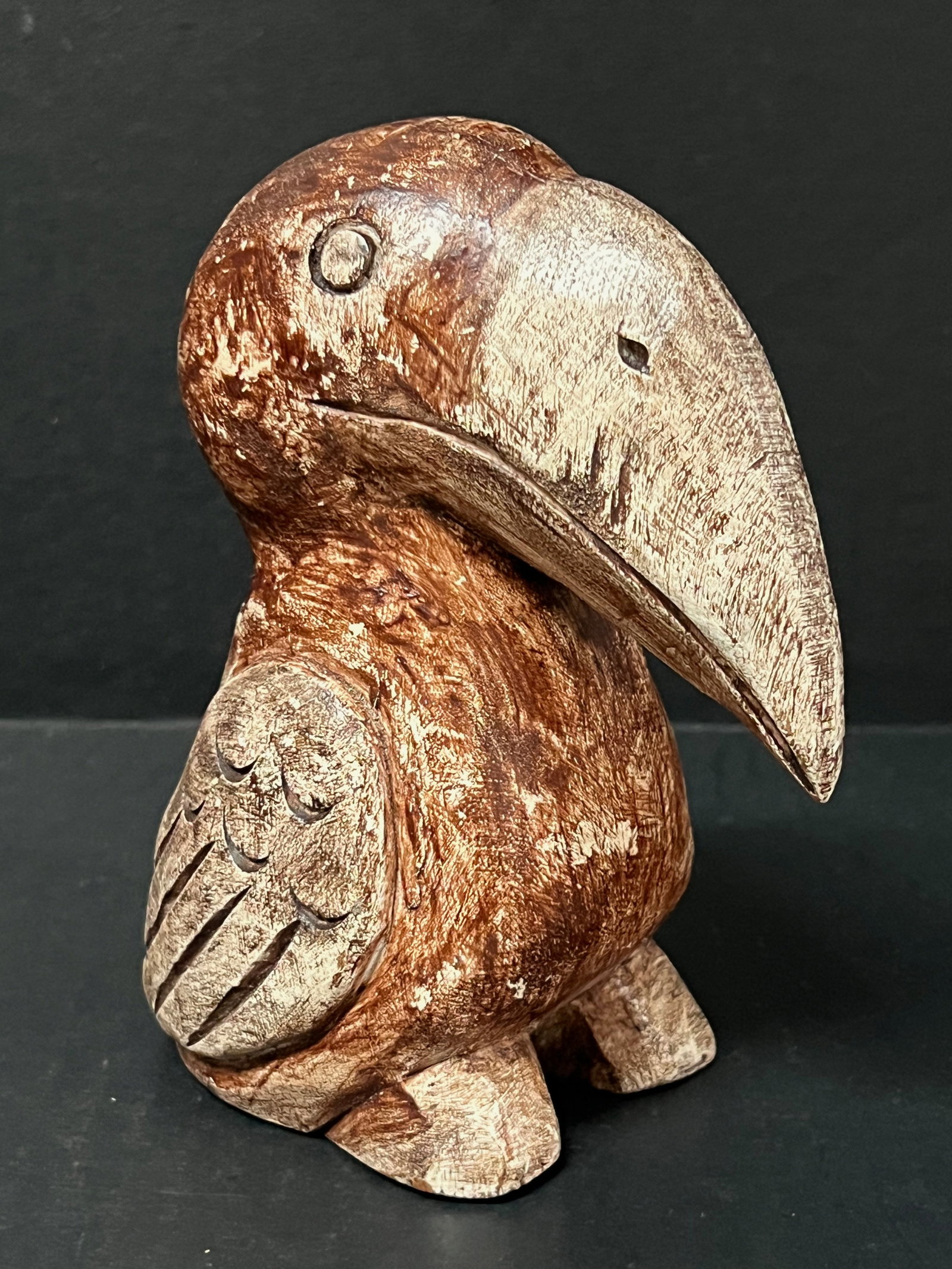 Carved Wood Parrot Sculpture: Folk Art Carved Wood Parrot Sculpture. The dimension is 6 inches high x 3 inches wide. Please be aware that some of the items are vintage, secondhand, old ages, antiques and may have a defects or sign