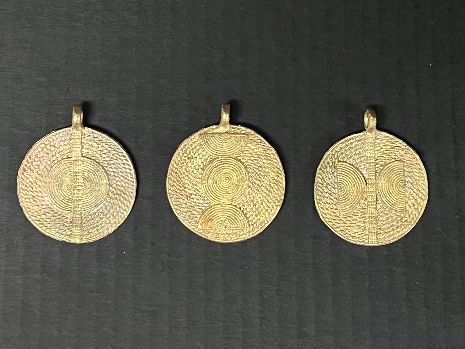 Ashanti Brass Pendant Lot of 3: African Tribal Art Ashanti Brass Pendant Lot of 3. The dimension is 2.5 inches high x 2 inches wide. Please be aware that some of the items are vintage, secondhand, old ages, antiques and may have a d