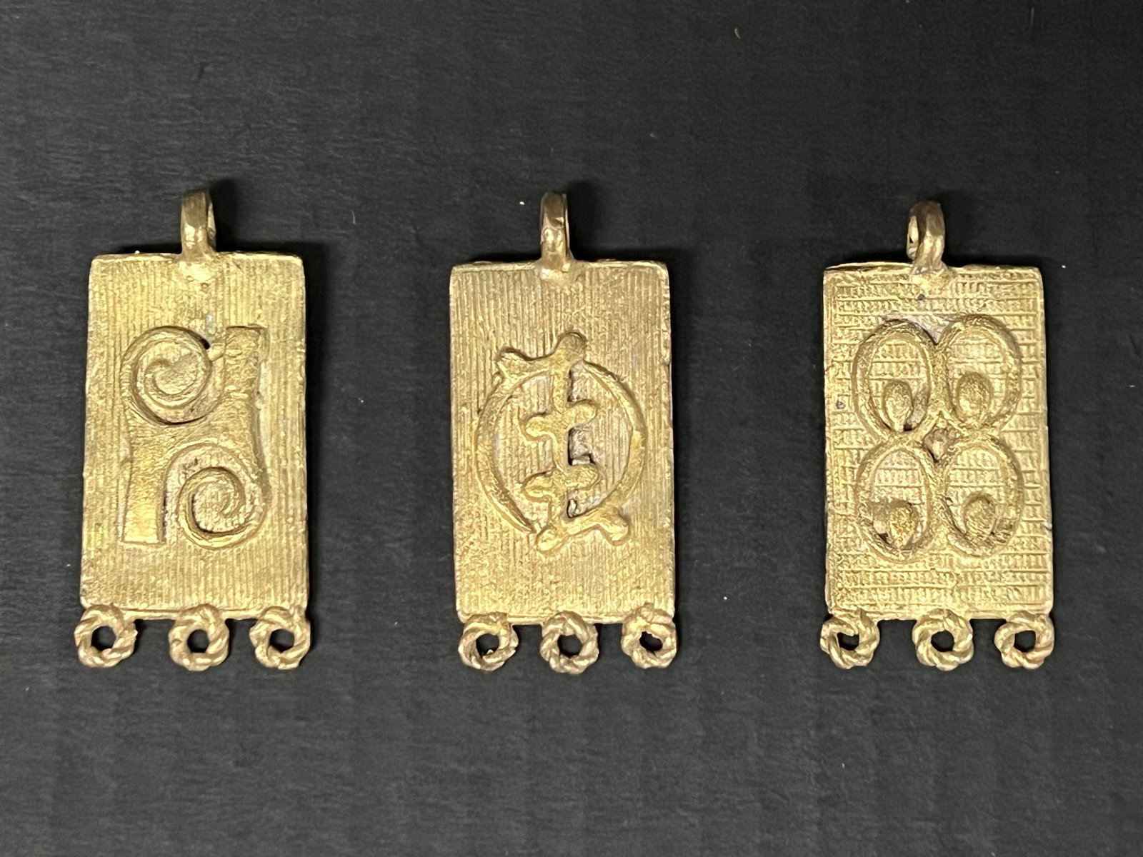 Ashanti Brass Pendant Lot of 3: African Tribal Art Ashanti Brass Pendant Lot of 3. The dimension is 2.5 inches high x 2 inches wide. Please be aware that some of the items are vintage, secondhand, old ages, antiques and may have a d