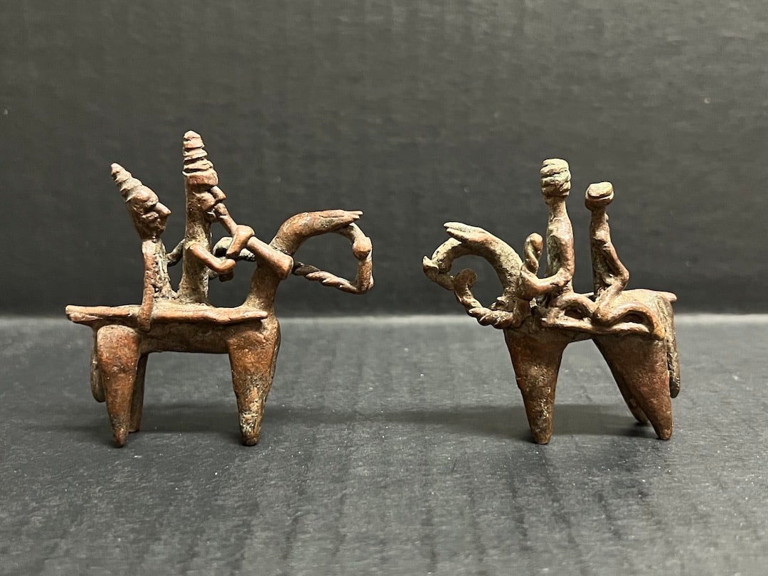 Pair of Bronze Kotoko Horsemen: Pair of Bronze Kotoko Horsemen. The dimension is 2.5 inches high x 2.5 inches wide. Please be aware that some of the items are vintage, secondhand, old ages, antiques and may have a defects or sign