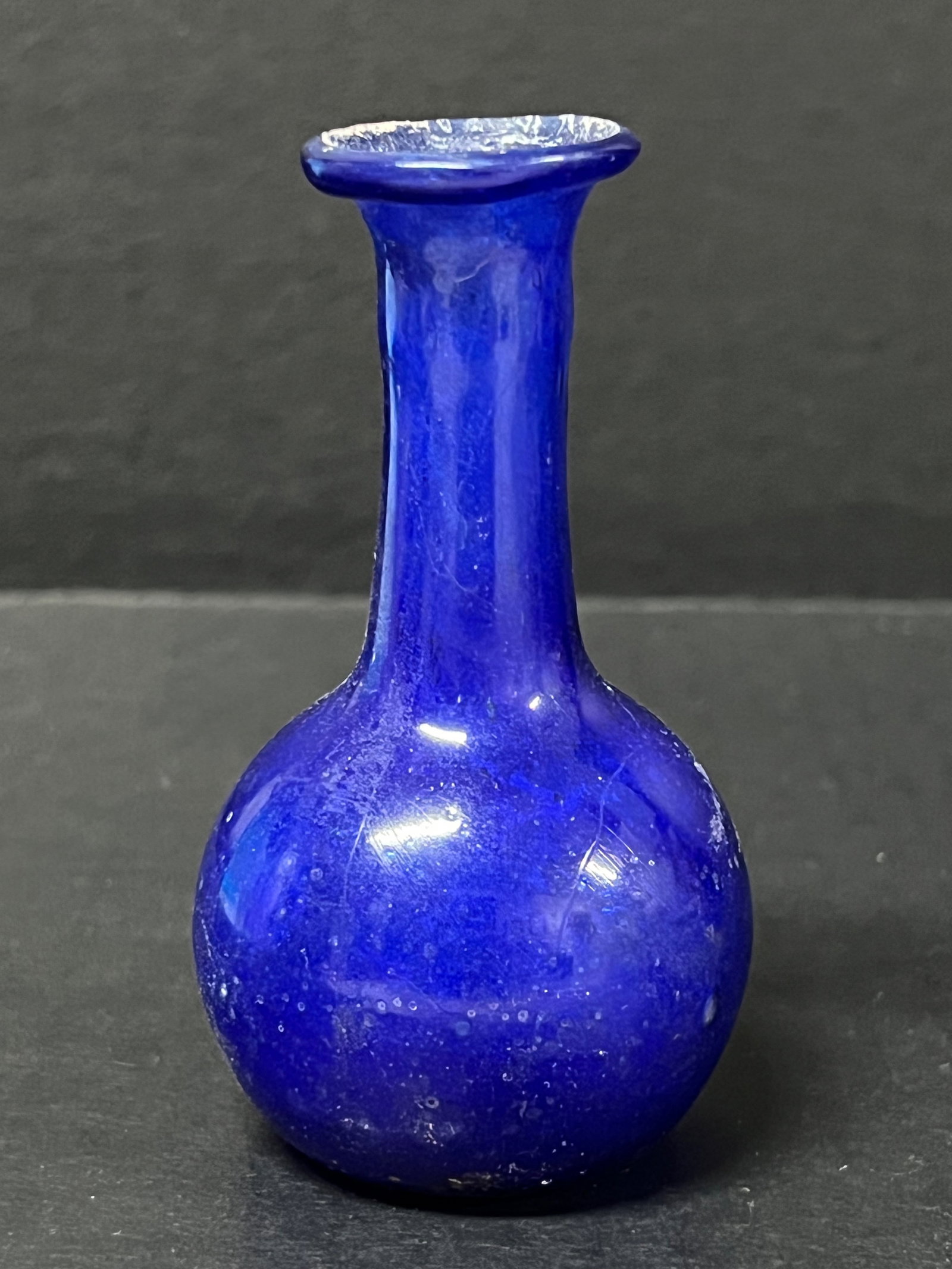 Roman Art Style Glass Bottle: Roman Art Style Glass Bottle. The dimension is 4 inches high x 2 inches wide. Please be aware that some of the items are vintage, secondhand, old ages, antiques and may have a defects or sign of ages,