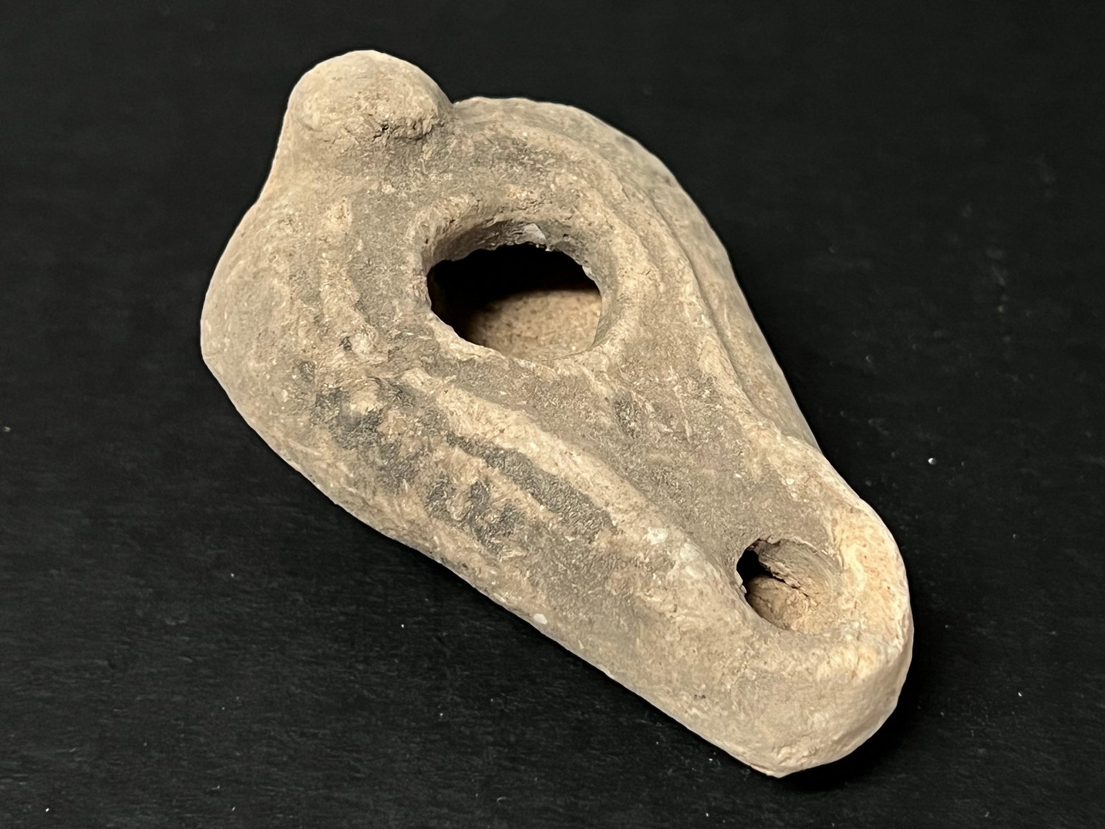 Vintage Terra Cotta Oil Lamp: Vintage Terra Cotta Oil Lamp. The dimension is 1 inches high x 2 inches wide. Please be aware that some of the items are vintage, secondhand, old ages, antiques and may have a defects or sign of ages,