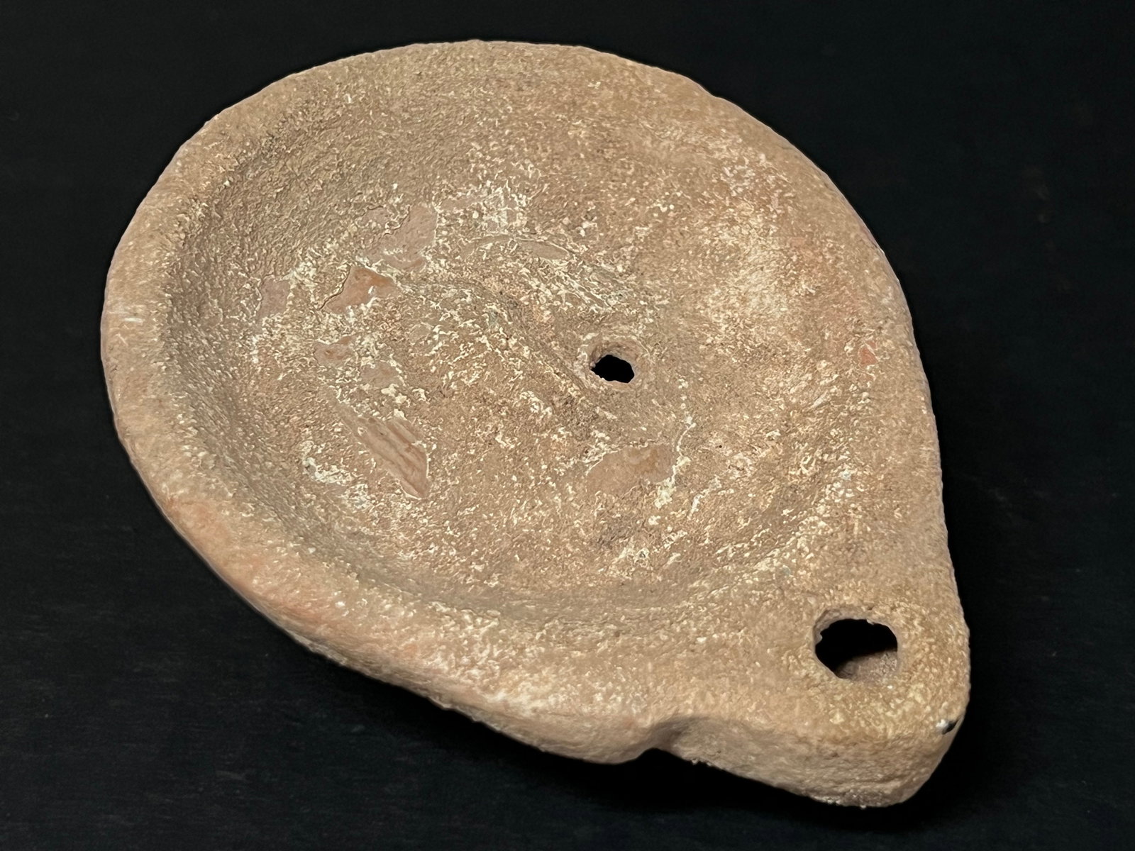 Vintage Terra Cotta Oil Lamp: Vintage Terra Cotta Oil Lamp. The dimension is 1 inches high x 2 inches wide. Please be aware that some of the items are vintage, secondhand, old ages, antiques and may have a defects or sign of ages,