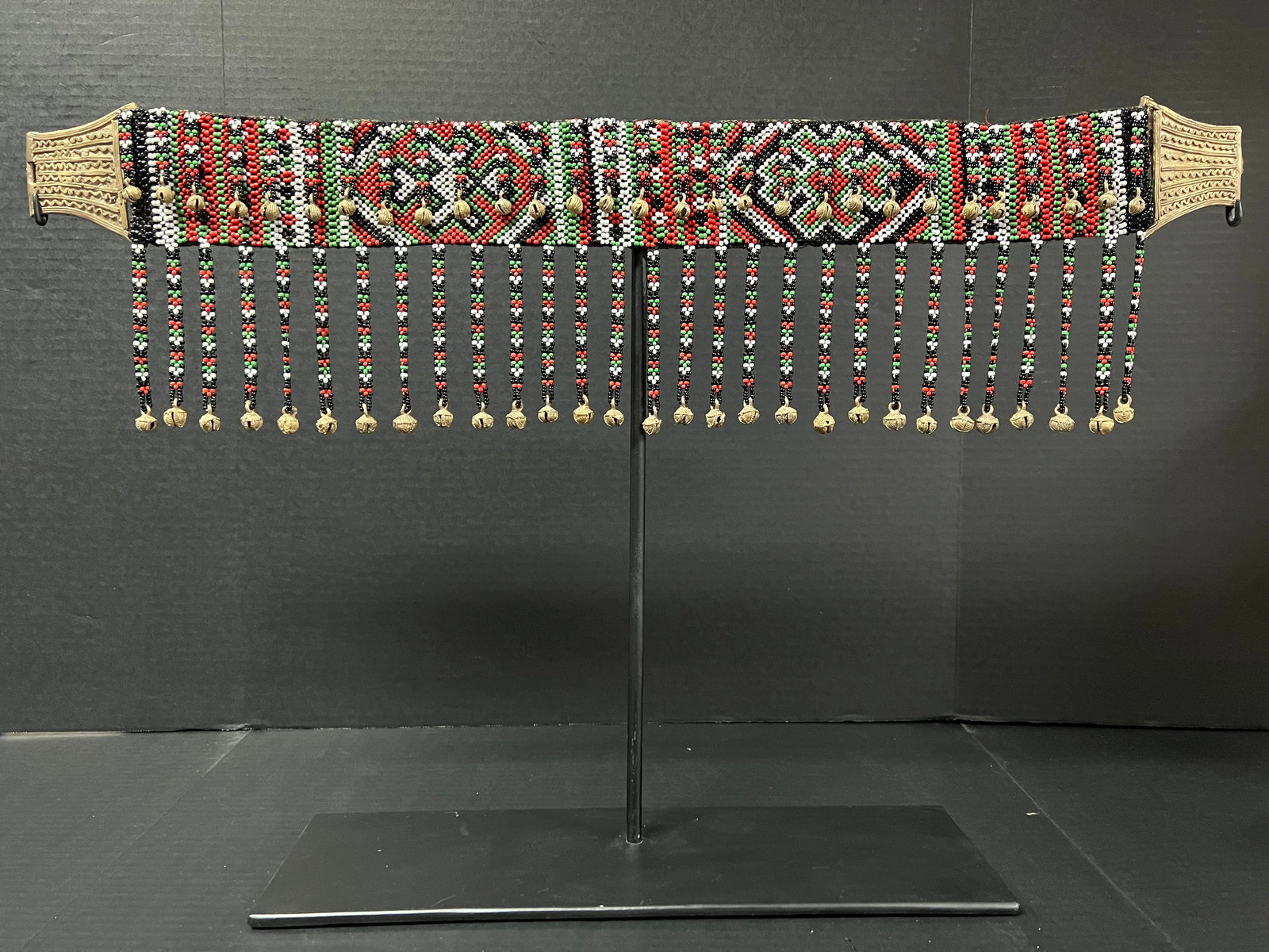 Philippine Tribal Art T'Boli Embroidered and Beaded Belts with Display Stand: Philippine Tribal Art T'boli Embroidered and Beaded Belts with Display Stand. The dimension is 29 inches high x 18.5 inches wide. Please be aware that some of the items are vintage, secondhand, old