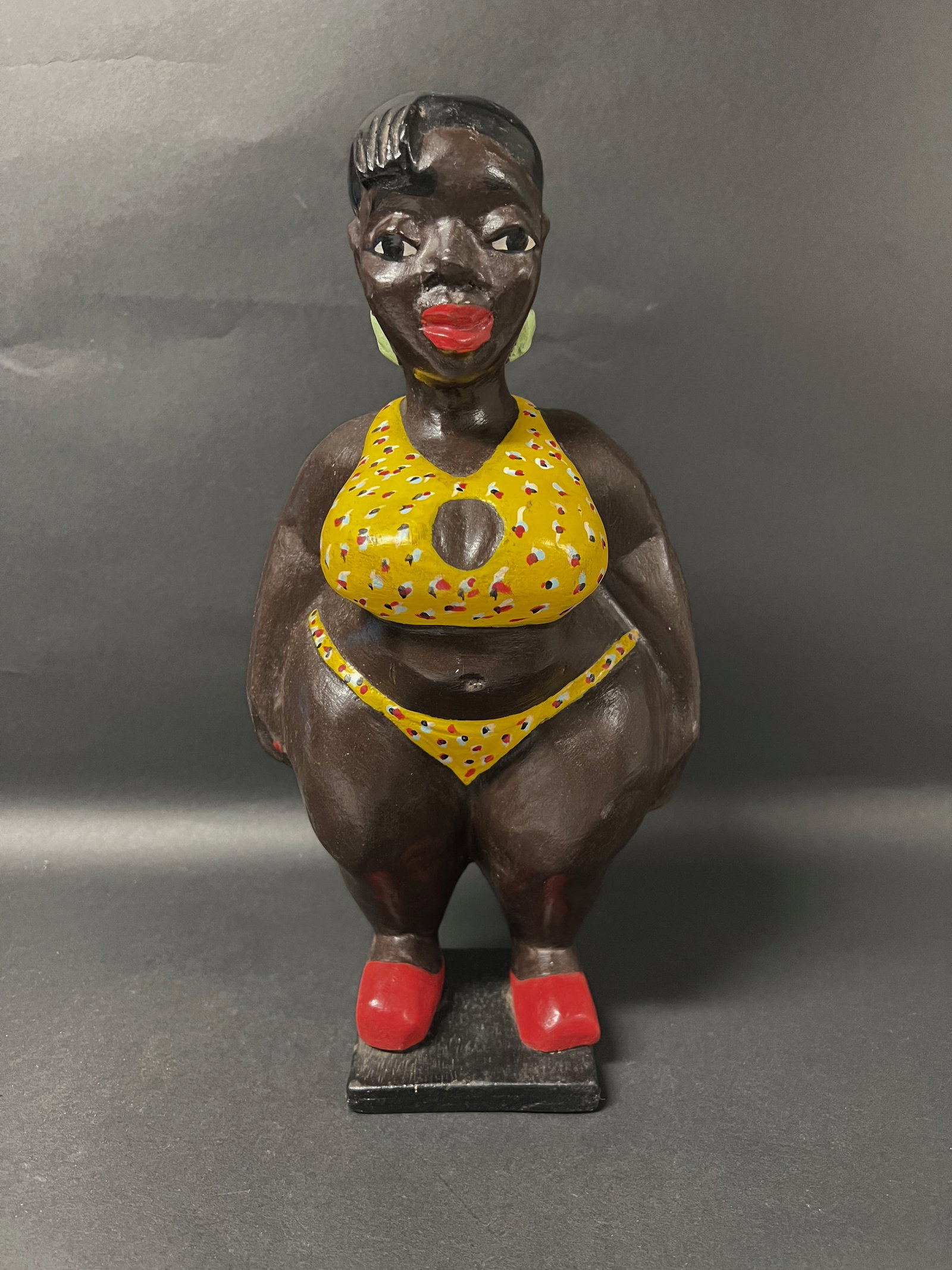 Colonial Statue: African Art Carved Wood Colonial Statue. The dimension is 12.5 inches high x 6.5 inches wide including base. Please be aware that some of the items are vintage, secondhand, old ages, antiques and may 
