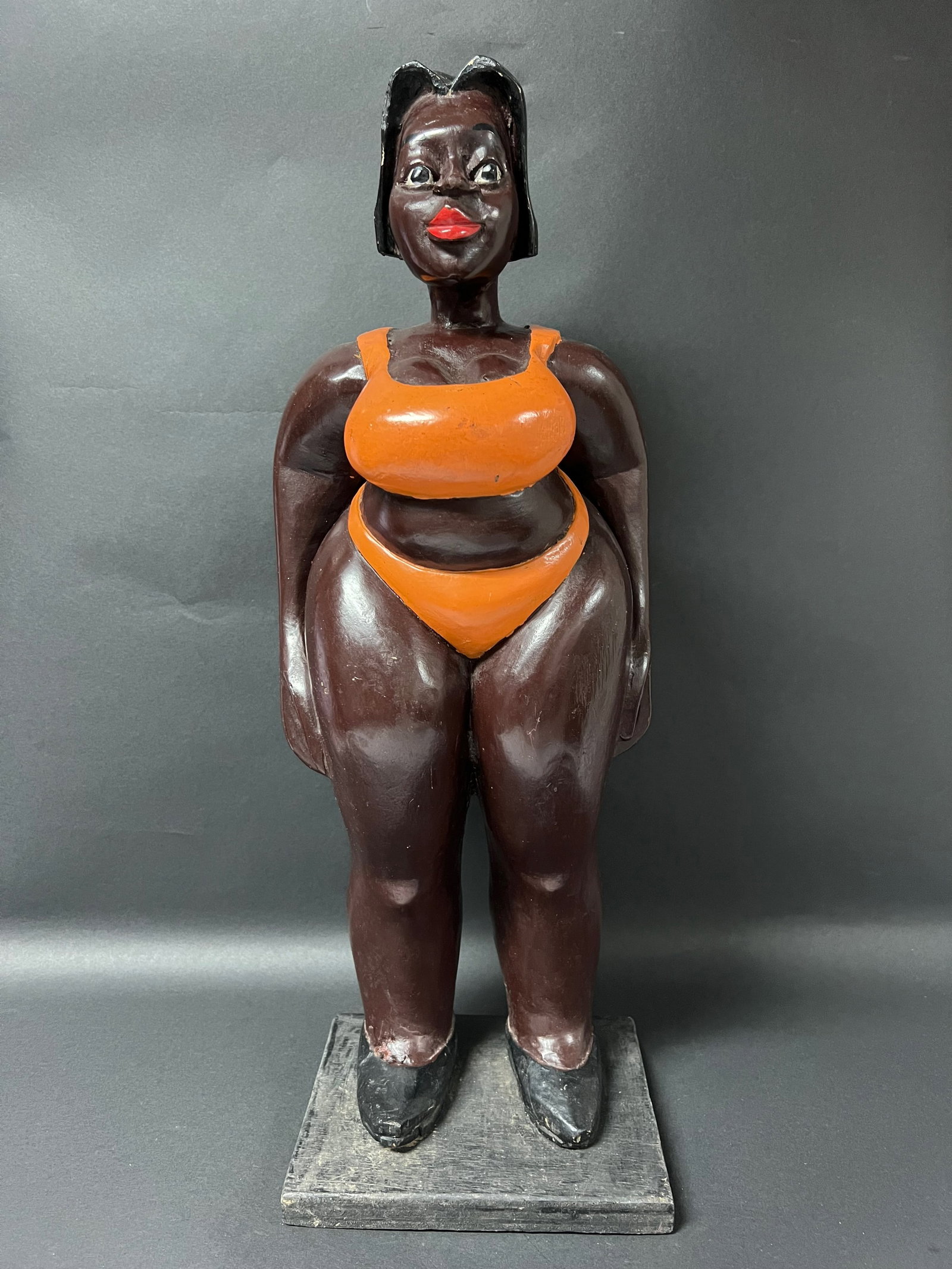 Colonial Statue: African Art Carved Wood Colonial Statue. The dimension is 21 inches high x 8 inches wide including base. Please be aware that some of the items are vintage, secondhand, old ages, antiques and may