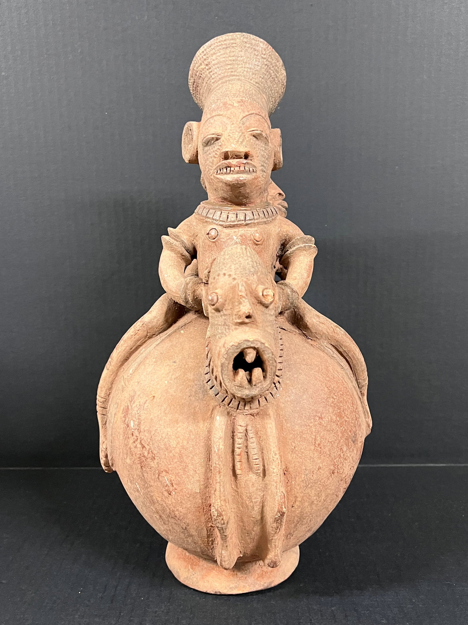 Mangbetu Pot: African Tribal Art Mangbetu Pot. The dimension is 16 inches high x 9 inches depth x 8 inches wide. Please be aware that some of the items are vintage, secondhand, old ages, antiques and may have a def