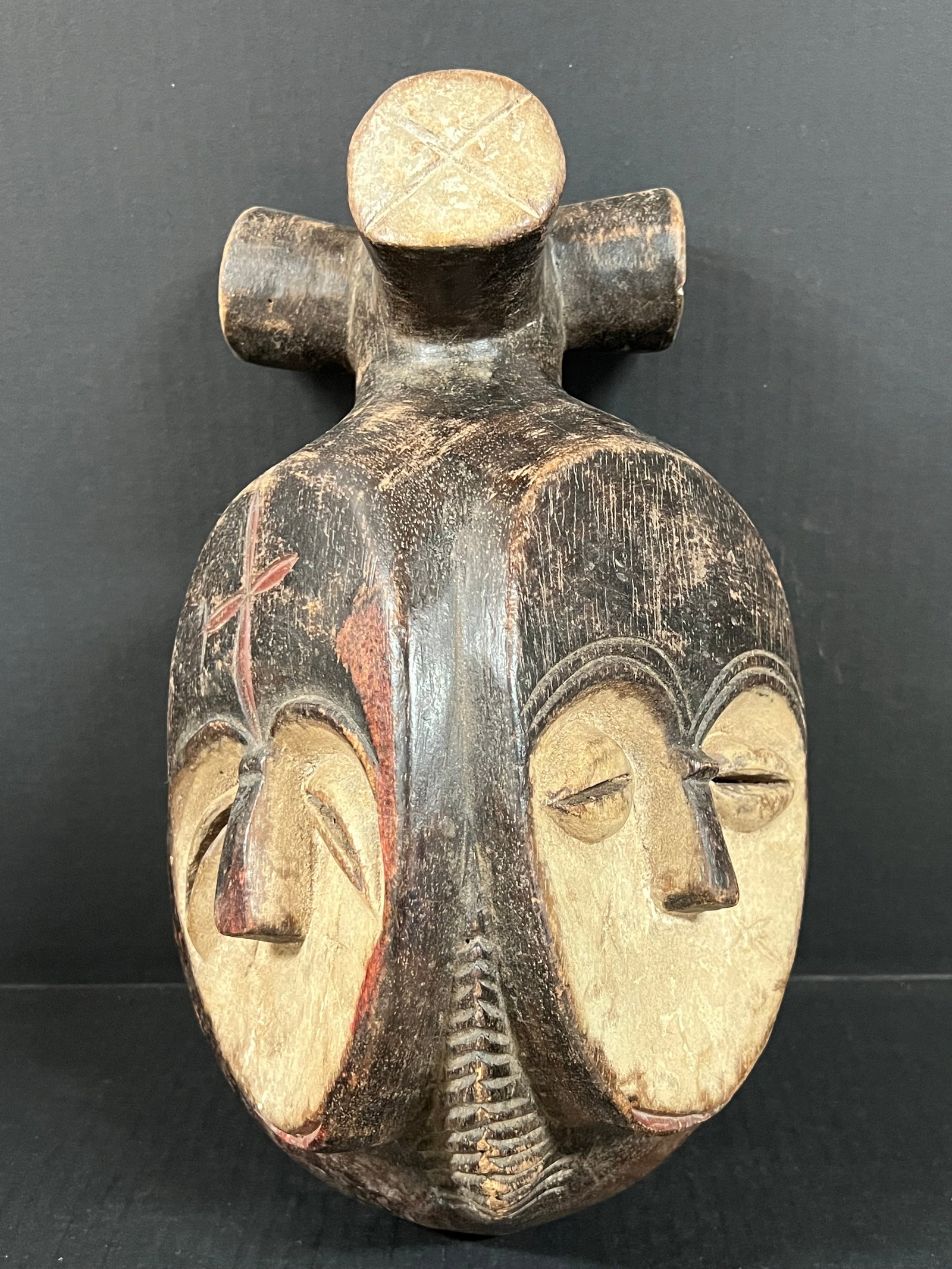 Kwele Mask: African Tribal Art Kwele Mask. The dimension is 13.5 inches high x 6.5 inches depth x 9 inches wide. Please be aware that some of the items are vintage, secondhand, old ages, antiques and may have a