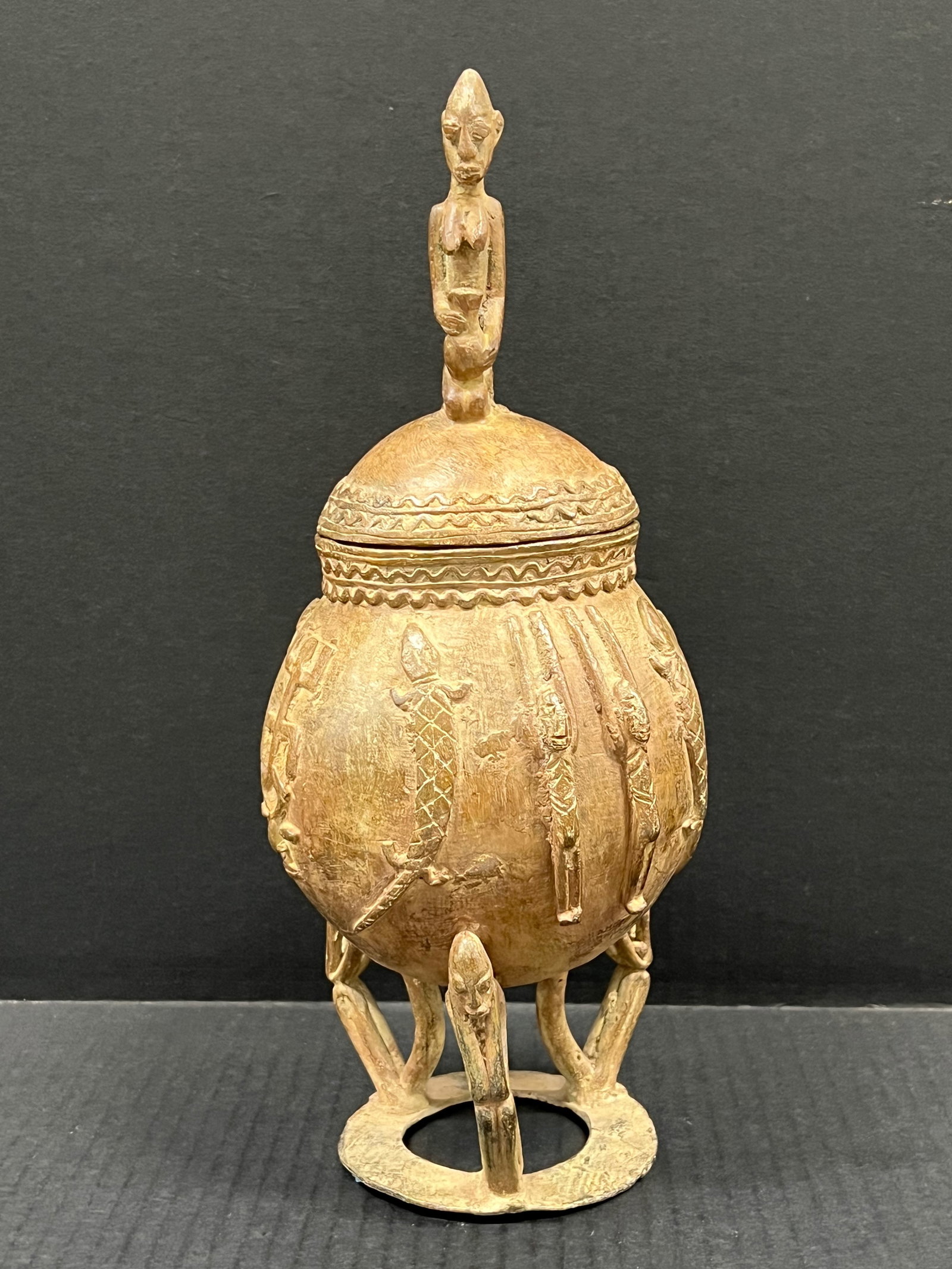 Dogon Bronze Medicine Container: African Tribal Art Dogon Bronze Medicine Container. The dimension is 12.5 inches high x 5.5 inches wide. Please be aware that some of the items are vintage, secondhand, old ages, antiques and may have