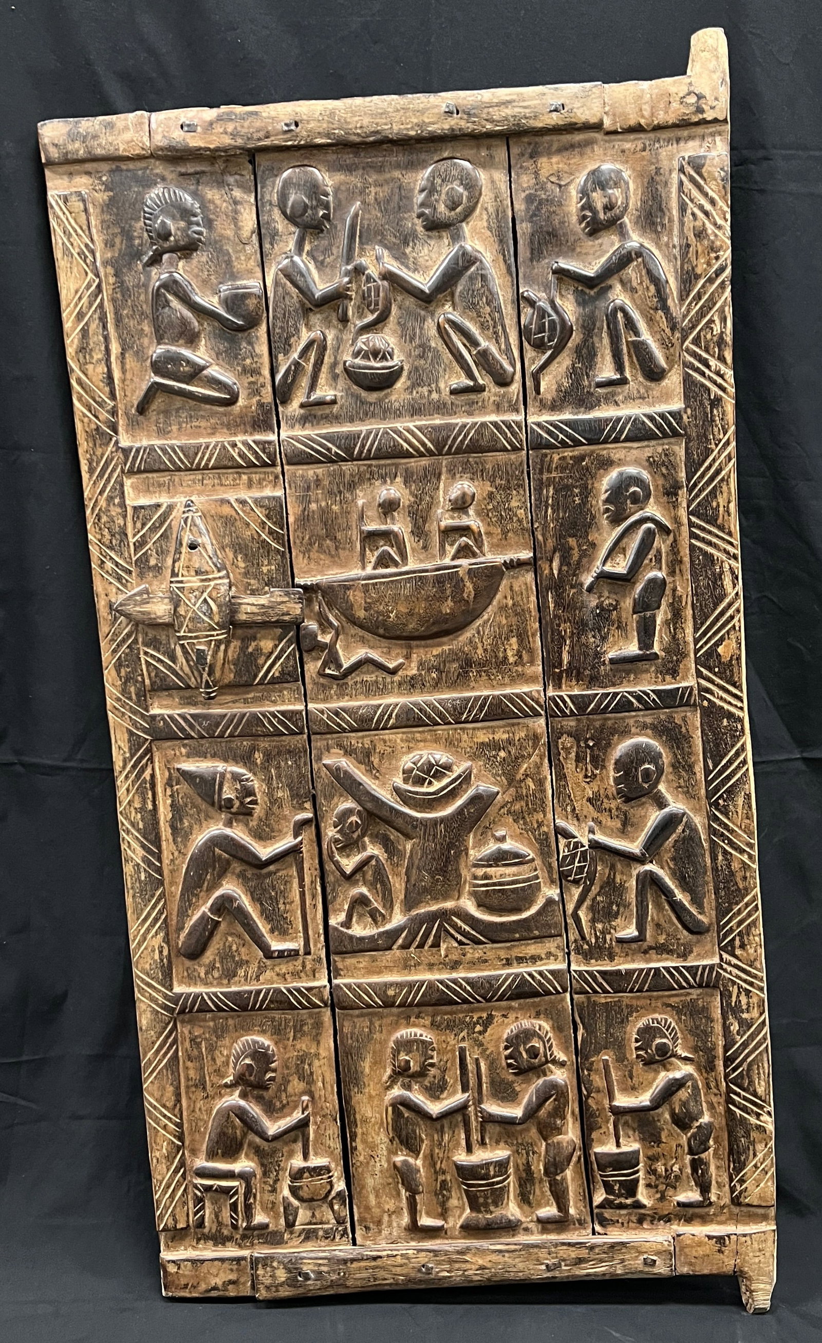 Carved Wood Large Dogon Door: African Tribal Art Carved Wood Large Dogon Door. The dimension is 48 inches high x 23.5 inches wide. Please be aware that some of the items are vintage, secondhand, old ages, antiques and may have a
