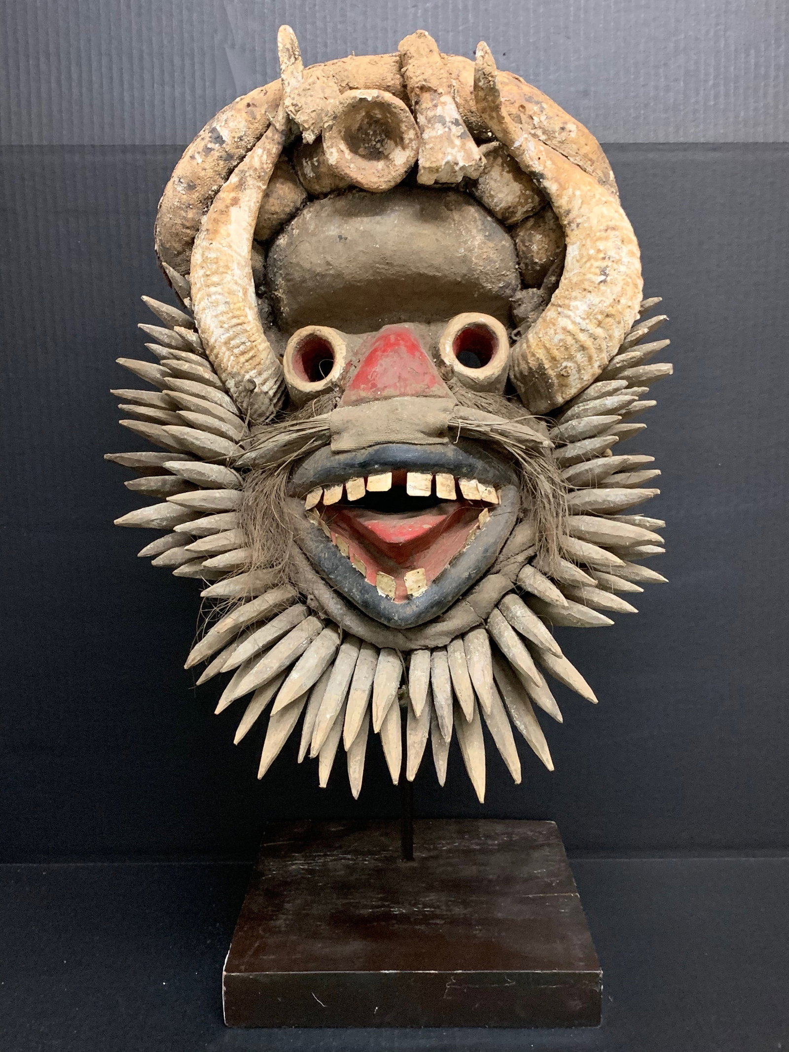 Carved Wood We Guere Mask with Display stand: African Tribal Art Carved Wood We Guere Mask with Display Stand. The dimension is 25 inches high x 14 inches wide. Please be aware that some of the items are vintage, secondhand, old ages, antiques an