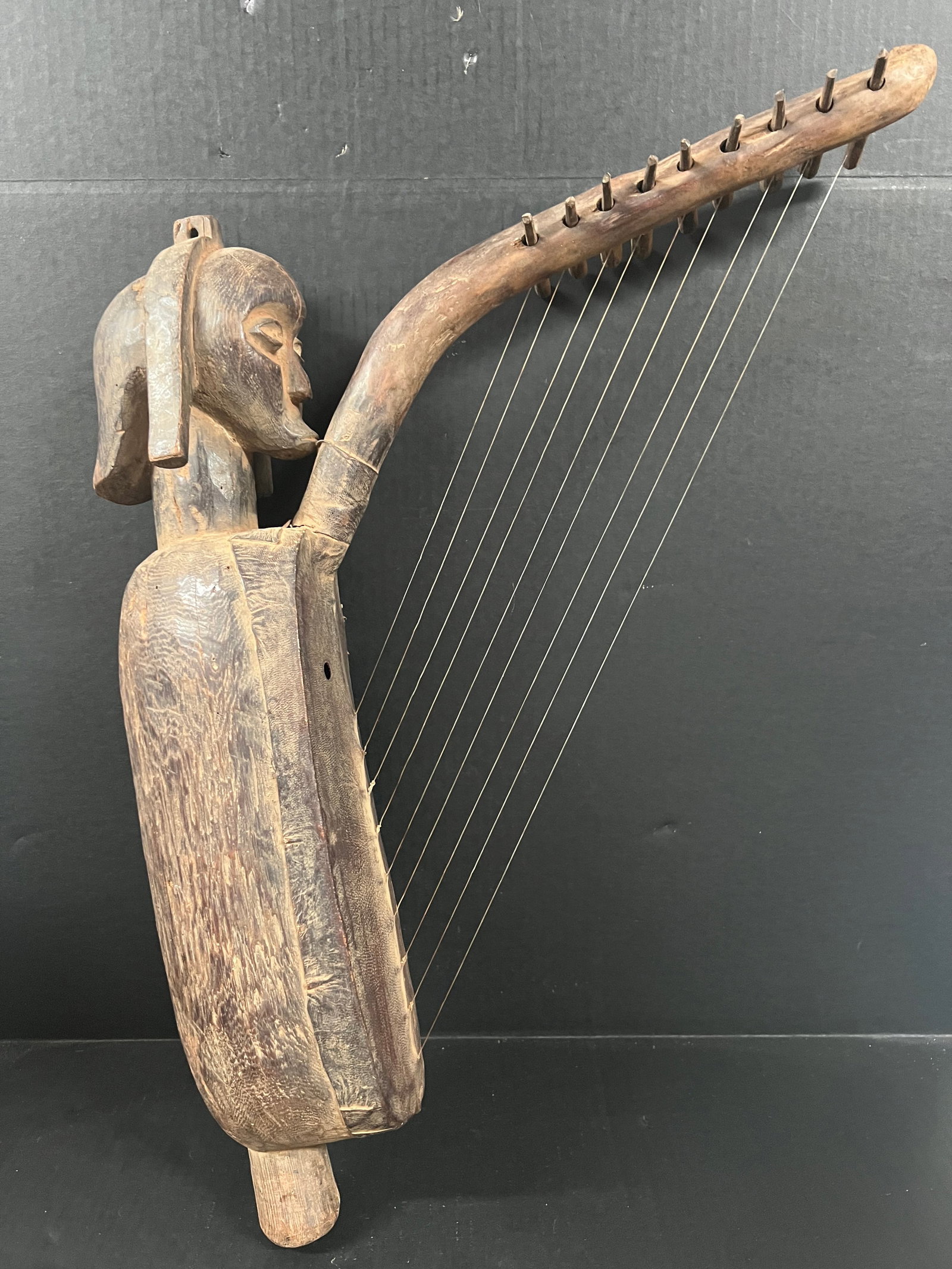 Carved Wood Fang Harp Instrument Sculpture: African Tribal Art Carved Wood Fang Harp Instrument Sculpture. The dimension is 24 inches high x 20.5 inches wide. Please be aware that some of the items are vintage, secondhand, old ages, antiques an