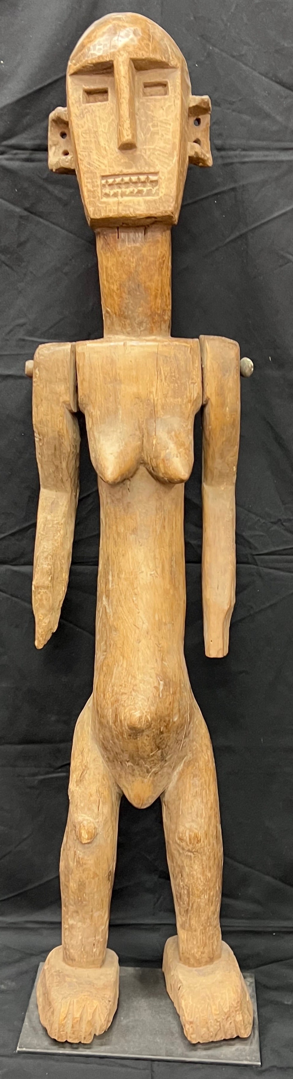 Carved Wood Large Lega Statue: African Tribal Art Carved Wood Large Lega Statue. The dimension is 49.5 inches high x 11 inches wide. Please be aware that some of the items are vintage, secondhand, old ages, antiques and may have a 