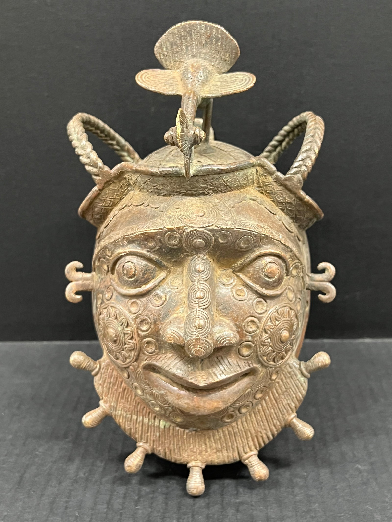 Bronze Bamileke Mask: African Tribal Art Bronze Bamileke Mask. The dimension is 10 inches high x 7 inches wide. Please be aware that some of the items are vintage, secondhand, old ages, antiques and may have a defects or s
