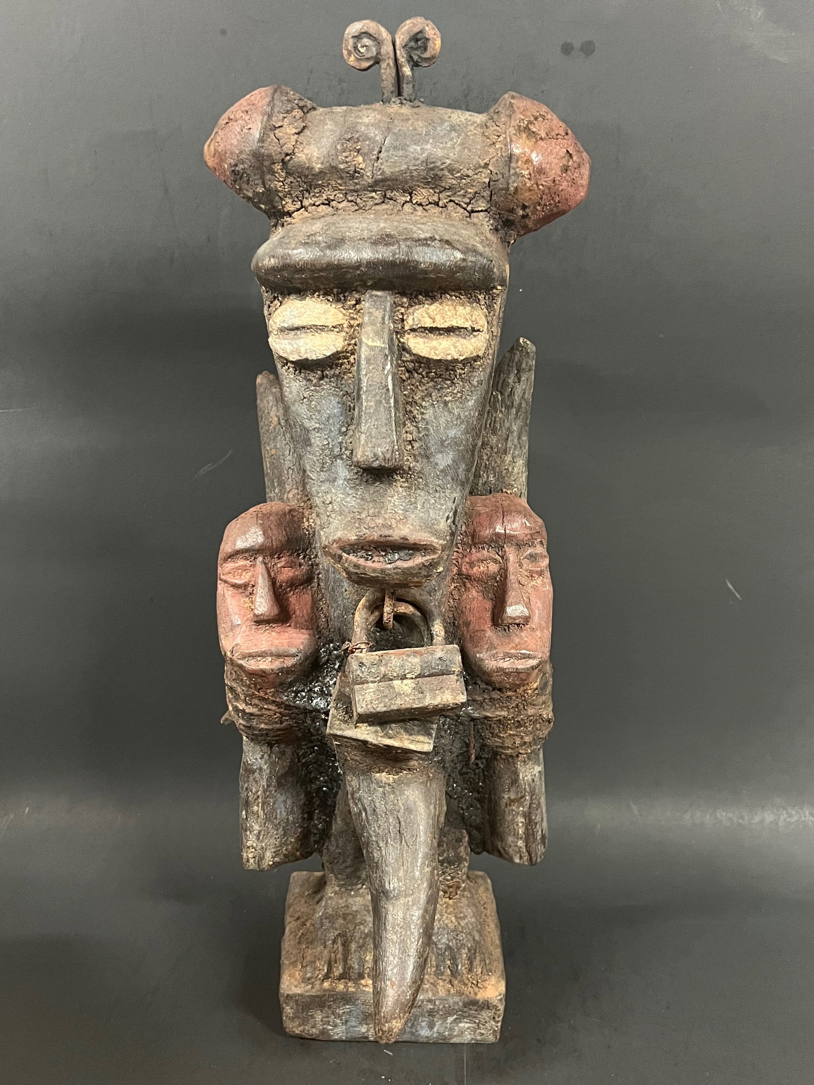 Carved Wood Bacongo Fetish Statue: African Tribal Art Carved Wood Bacongo Fetish Statue. The dimension is 18 inches high x 7 inches wide. Please be aware that some of the items are vintage, secondhand, old ages, antiques and may have