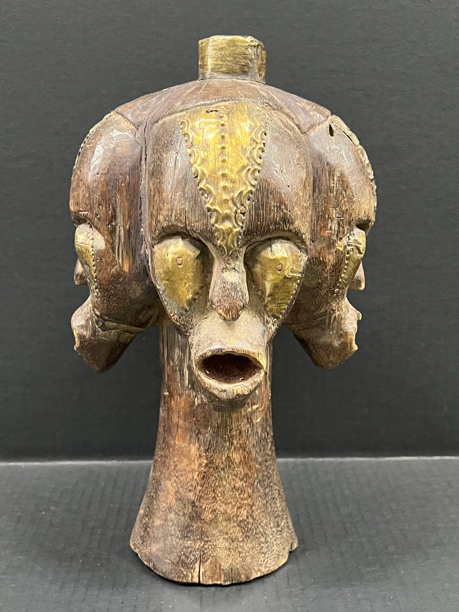 Carved Wood Fang Head Statue: African Tribal Art Carved Wood Fang Head Statue. The dimension is 13.5 inches high x 8 inches wide. Please be aware that some of the items are vintage, secondhand, old ages, antiques and may have a