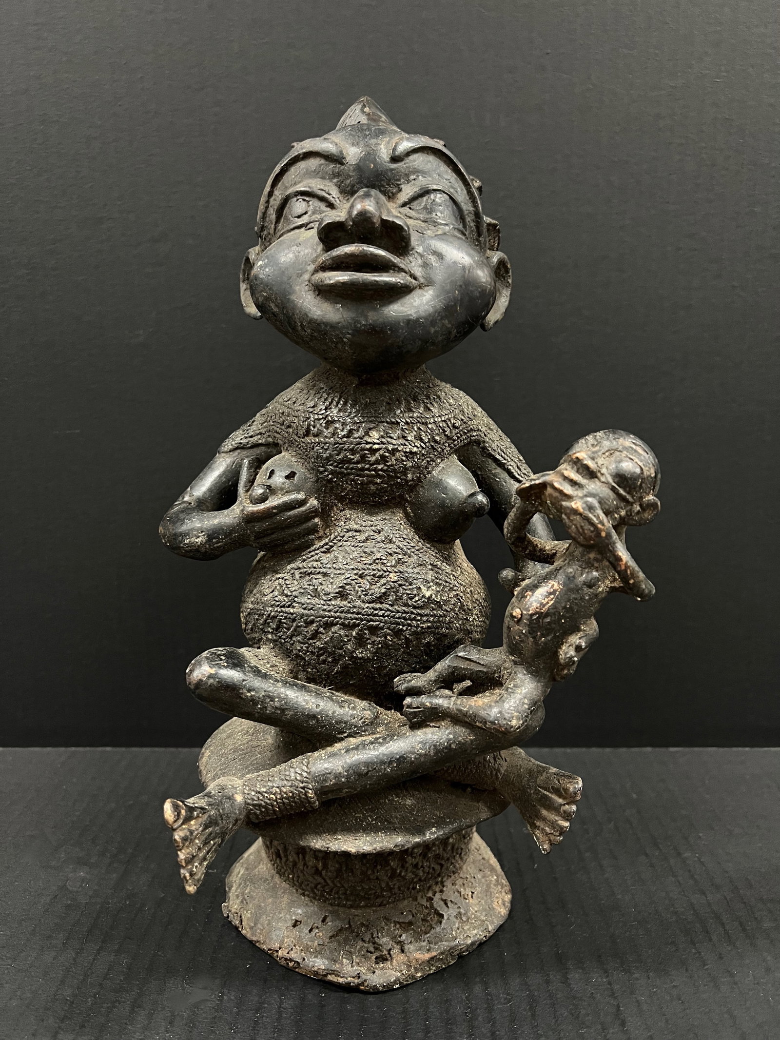 Bronze Bamileke Fertility Statue (Very Heavy): African Tribal Art Bronze Bamileke Fertility Statue Very Heavy. The dimension is 7.5 inches high x 9.5 inches wide. Please be aware that some of the items are vintage, secondhand, old ages, antiques