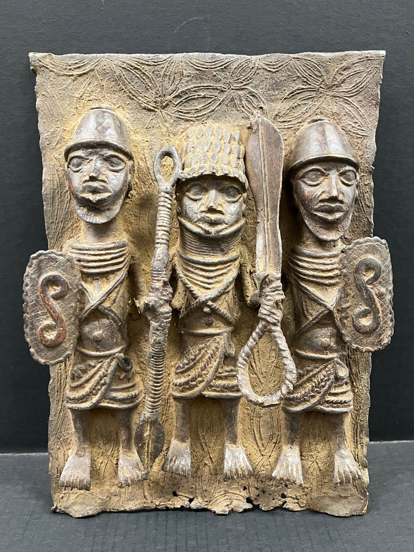 Benin Bronze Plaque Sculpture: African Tribal Art Benin Bronze Plaque Sculpture. The dimension is 11.5 inches high x 11 inches wide. Please be aware that some of the items are vintage, secondhand, old ages, antiques and may have a 