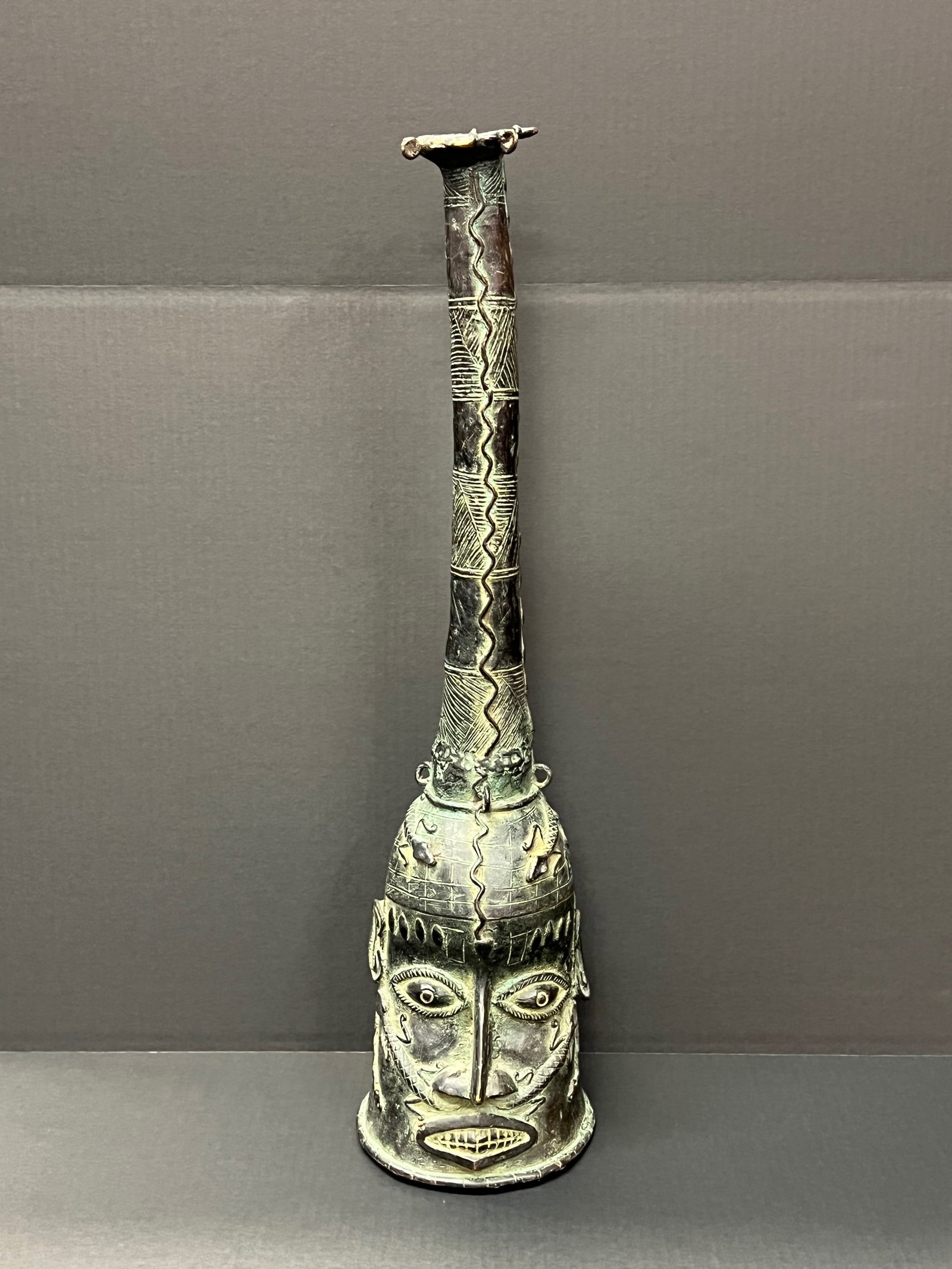 Large Benin Bronze Bell Sculpture: African Tribal Art Large Benin Bronze Bell Sculpture. The dimension is 28 inches high x 8 inches wide. Please be aware that some of the items are vintage, secondhand, old ages, antiques and may have a