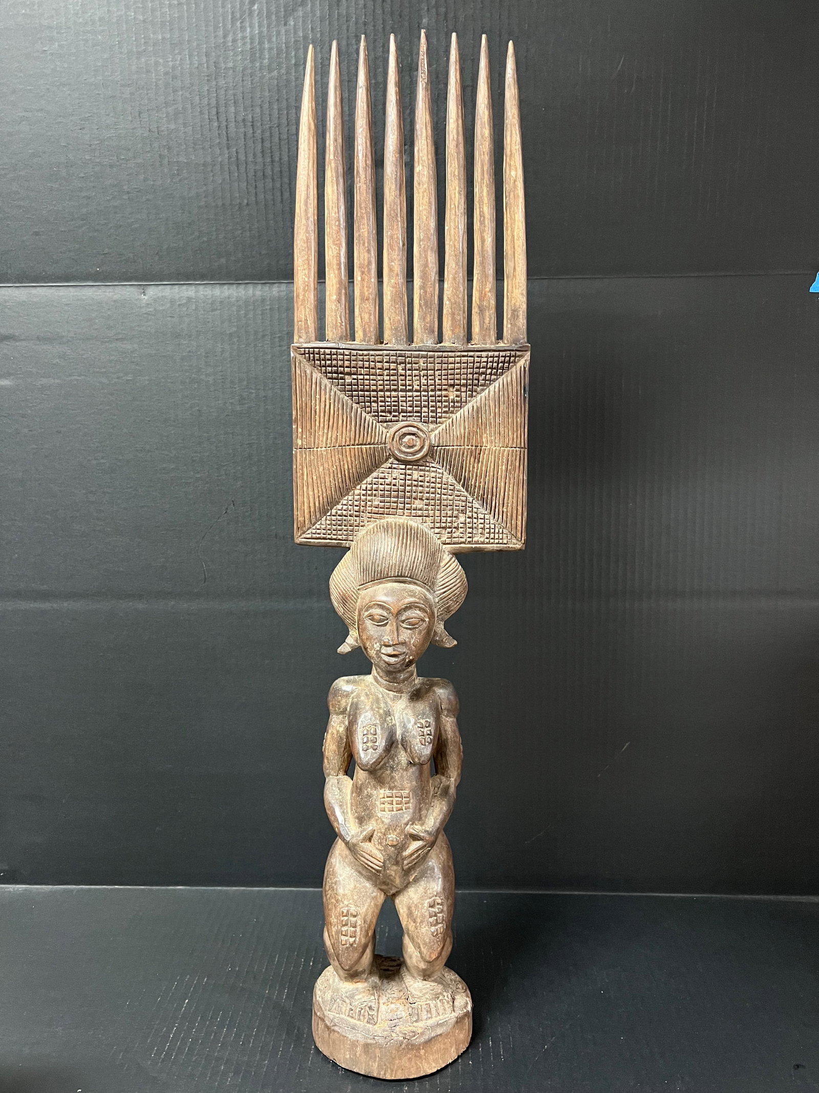 Carved Wood Baule Statue: African Tribal Art Carved Wood Baule Statue. The dimension is 30 inches high x 7.25 inches wide. Please be aware that some of the items are vintage, secondhand, old ages, antiques and may have a defec