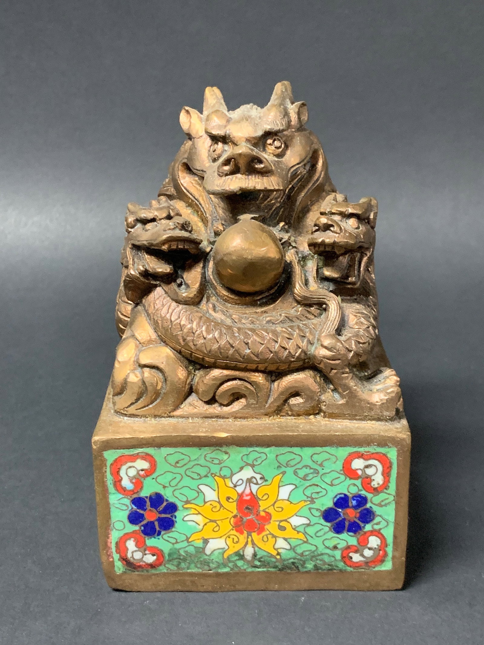 Bronze and Cloisonne Seal/Chop with Dragon and Floral Design: Chinese Art Bronze and Cloisonné Seal/Chop with Dragon and Floral Design. The dimension is 5.5 inches high x 3.5 inches wide. Please be aware that some of the items are vintage, secondhand, old ages,
