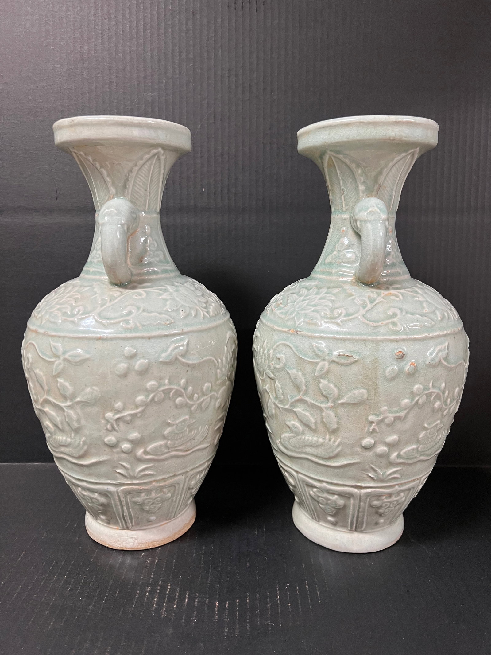 Pair of Porcelain Celadon Vase Raised Floral Design: Chinese Art Porcelain Celadon Vase Raised Floral Design. The dimension is 14.5 inches high x 7.5 inches wide. Please be aware that some of the items are vintage, secondhand, old ages, antiques and may