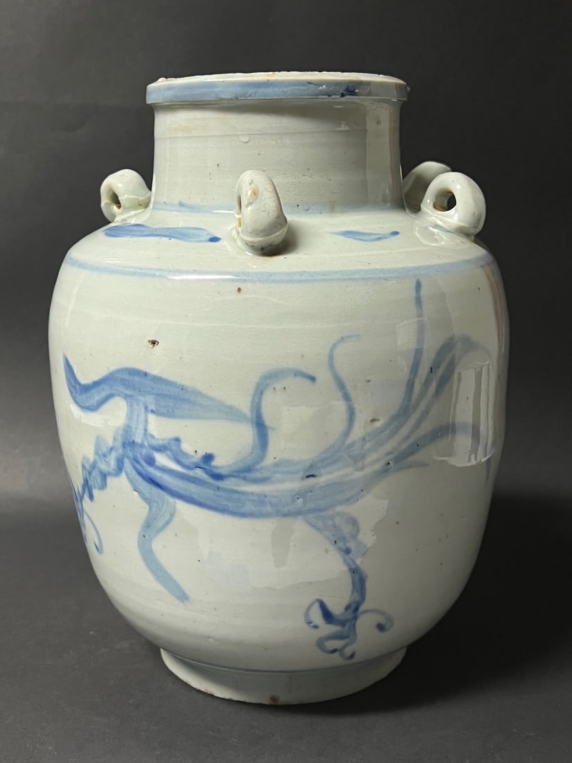 A Blue and White Porcelain Oil Pot: Chinese Art Blue and White Porcelain Oil Pot. The dimension is 10.5 inches high x 8.5 inches wide. Please be aware that some of the items are vintage, secondhand, old ages, antiques and may have a def