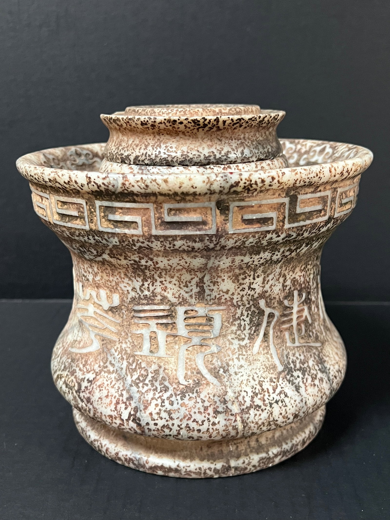 A Carved Soapstone Incense Burner: Chinese Art Carved Soapstone Incense Burner. The dimension is 7.5 inches high x 8 inches wide. Please be aware that some of the items are vintage, secondhand, old ages, antiques and may have a defects