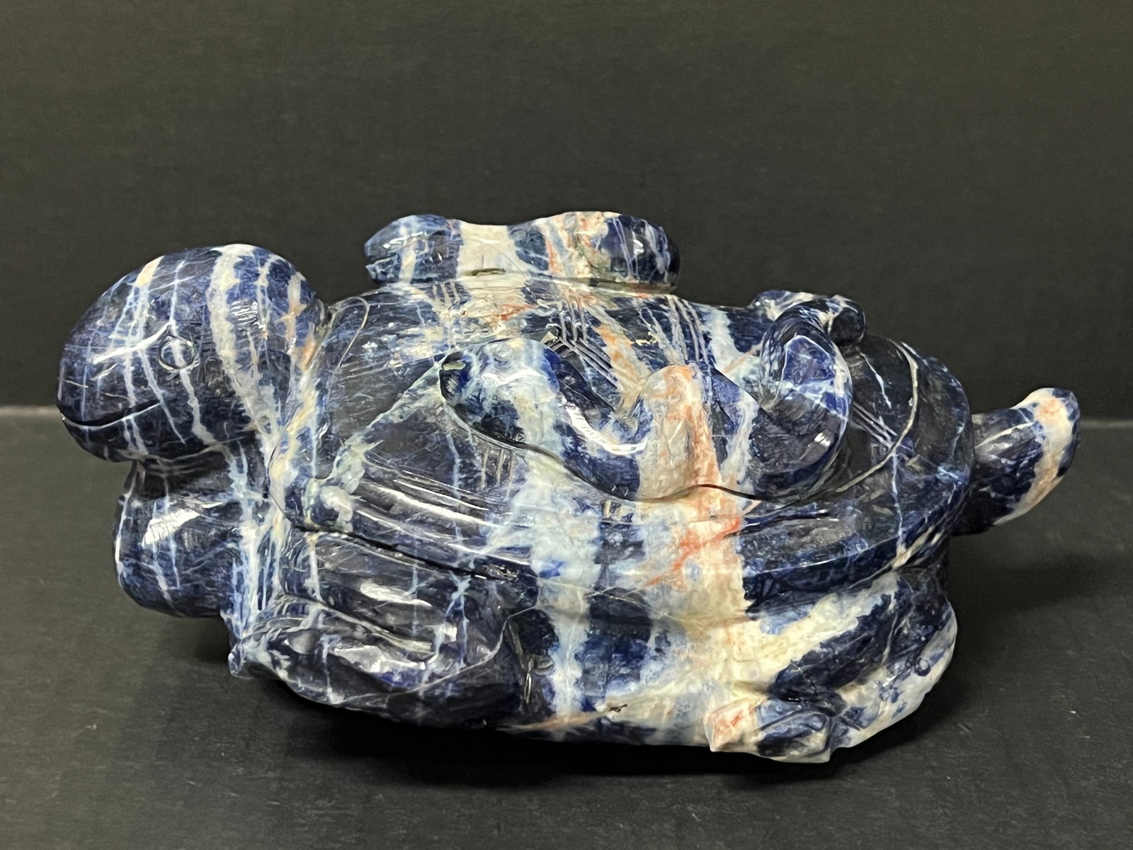 A Carved Sodalite Stone Turtle Sculpture: Chinese Art Carved Sodalite Stone Turtle Sculpture. The dimension is 3.5 inches high x 8 inches wide. Please be aware that some of the items are vintage, secondhand, old ages, antiques and may have a 