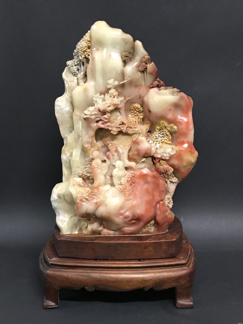 A Carved Chinese Shoushan Stone Mountain Landscape Scenery Sculpture: Chinese Art Carved Shoushan Stone Mountain Landscape Scenery Sculpture with Wooden Base. The dimension is 12.5 inches high x 7.5 inches wide. Please be aware that some of the items are vintage, second