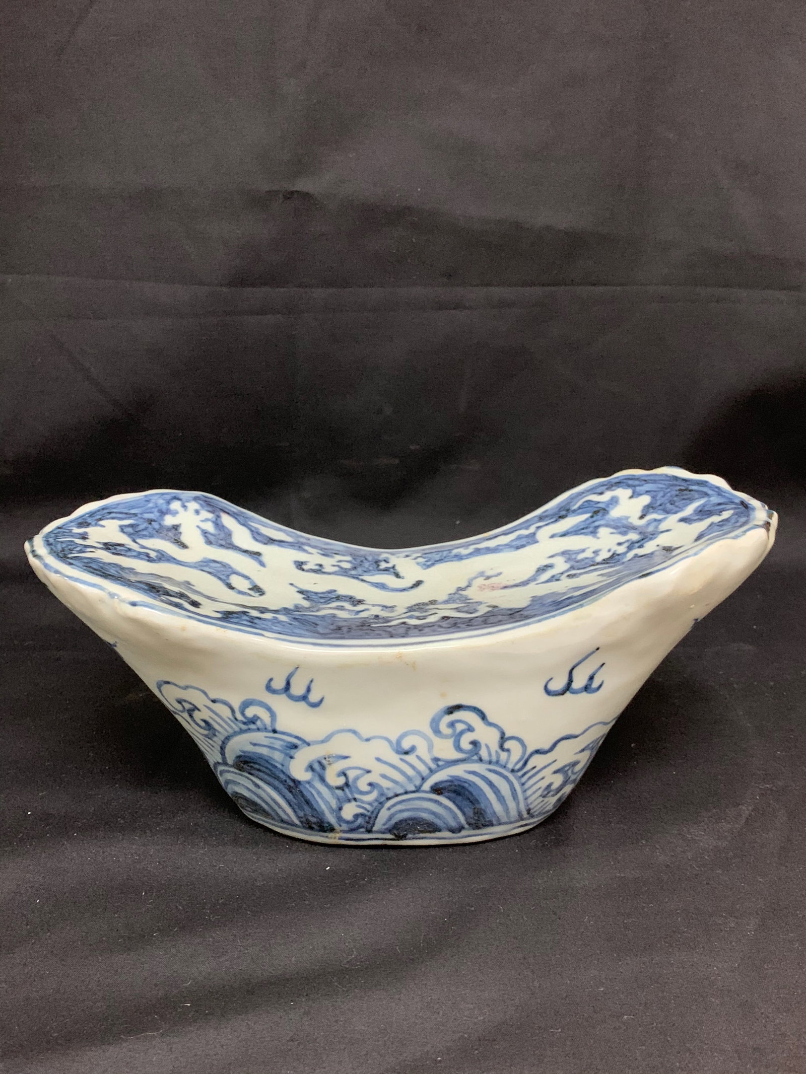 Chinese Art Blue and White Pillow: Chinese Art Porcelain Blue and White Pillow. The dimension is 4.5 inches high x 10 inches wide. Please be aware that some of the items are vintage, secondhand, old ages, antiques and may have a defect