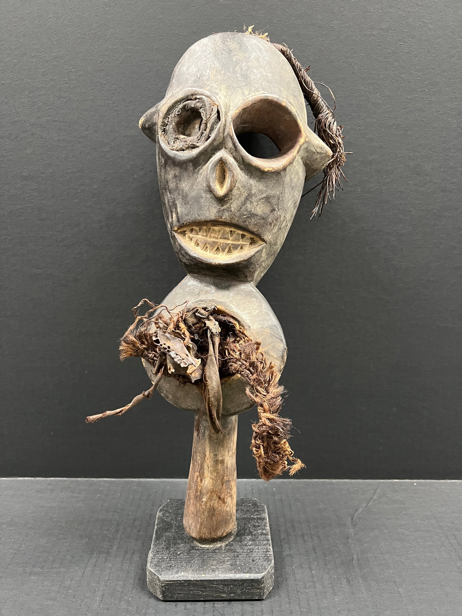 Carved Wood Fang Statue: African Tribal Art Carved Wood Fang Statue. The dimension is 18 inches high x 7 inches wide. Please be aware that some of the items are vintage, secondhand, old ages, antiques and may have a defects