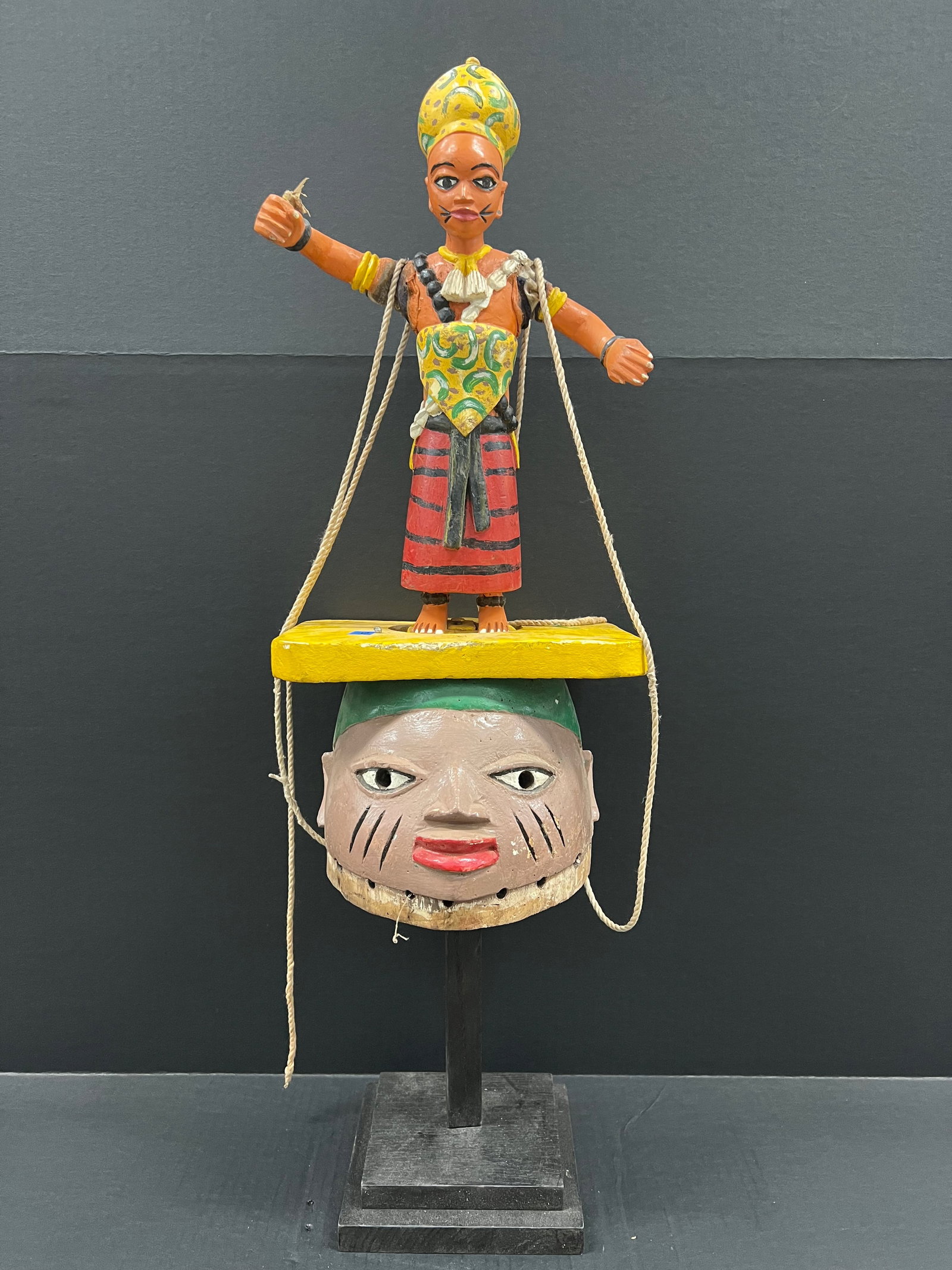 Carved Wood Gelede Helmet Mask with Display Stand: African Tribal Art Carved Wood Gelede Helmet Mask with Display Stand. The dimension is 31 inches high x 10 inches wide. Please be aware that some of the items are vintage, secondhand, old ages, antiqu