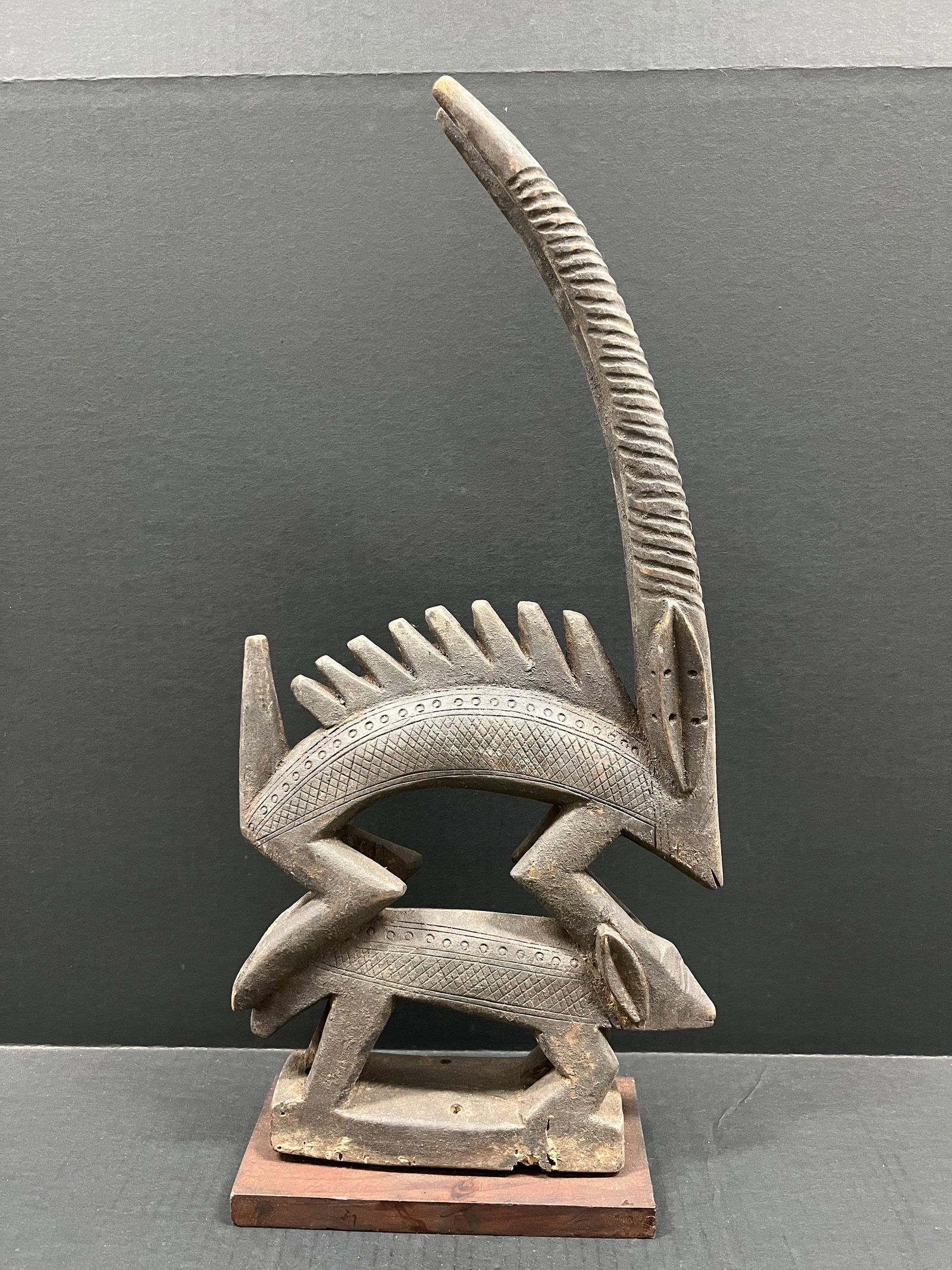 Carved Wood Chiwara Bamana Sculpture: African Tribal Art Carved Wood Chiwara Bamana Statue. The dimension is 23 inches high x 11 inches wide. Please be aware that some of the items are vintage, secondhand, old ages, antiques and may have