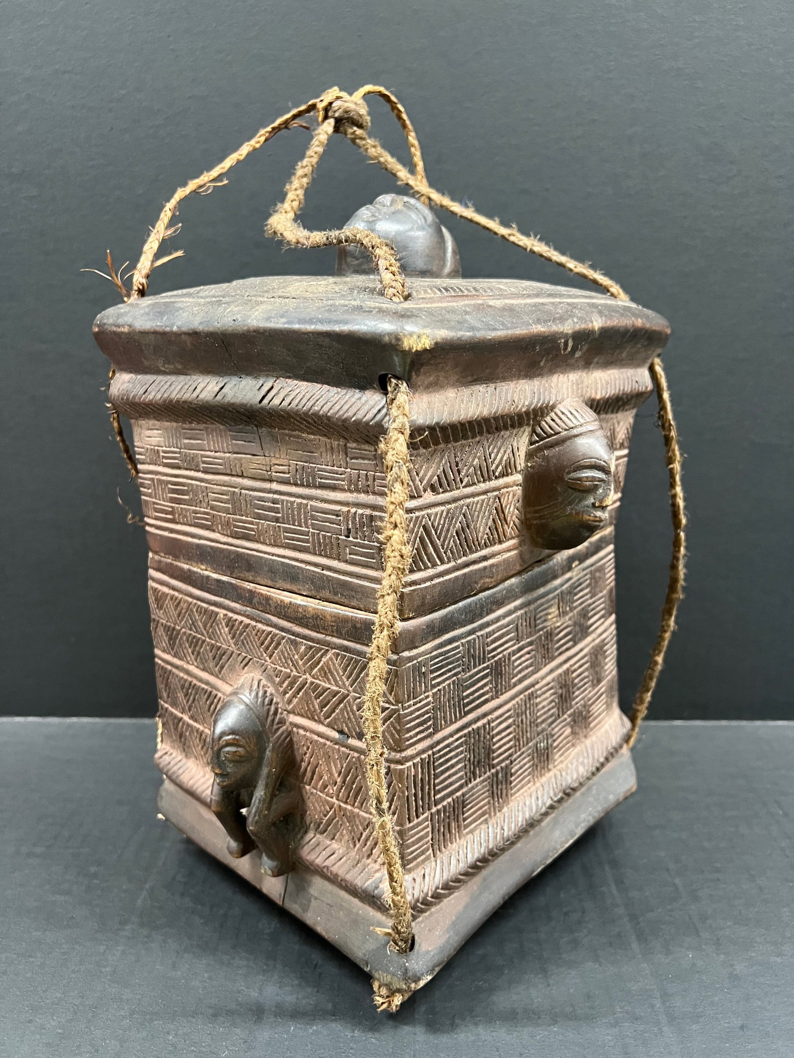 Carved Wood Kuba Box: African Tribal Art Carved Wood Kuba Box. The dimension is 12.5 inches high x 9 inches wide. Please be aware that some of the items are vintage, secondhand, old ages, antiques and may have a defects