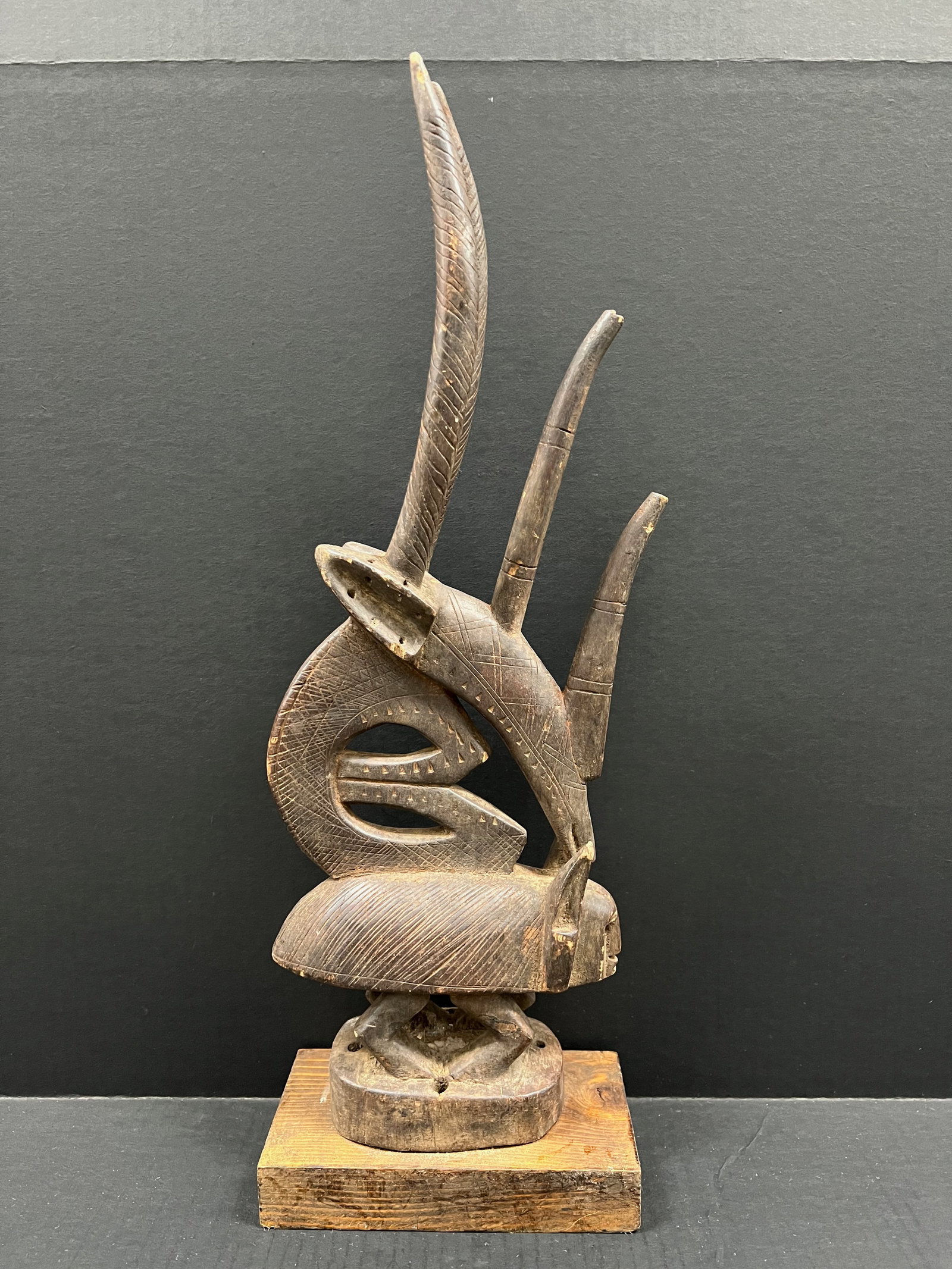 Carved Wood Chiwara Bamana Statue: African Tribal Art Carved Wood Chiwara Bamana Statue. The dimension is 23 inches high x 8.5 inches wide. Please be aware that some of the items are vintage, secondhand, old ages, antiques and may