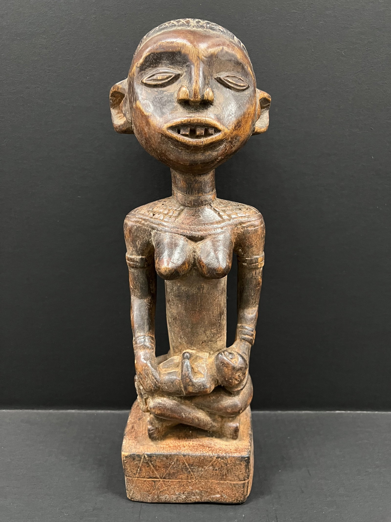 Carved Wood Luba Statue: African Tribal Art Carved Wood Luba Statue. The dimension is 18.5 inches high x 5 inches wide. Please be aware that some of the items are vintage, secondhand, old ages, antiques and may have a