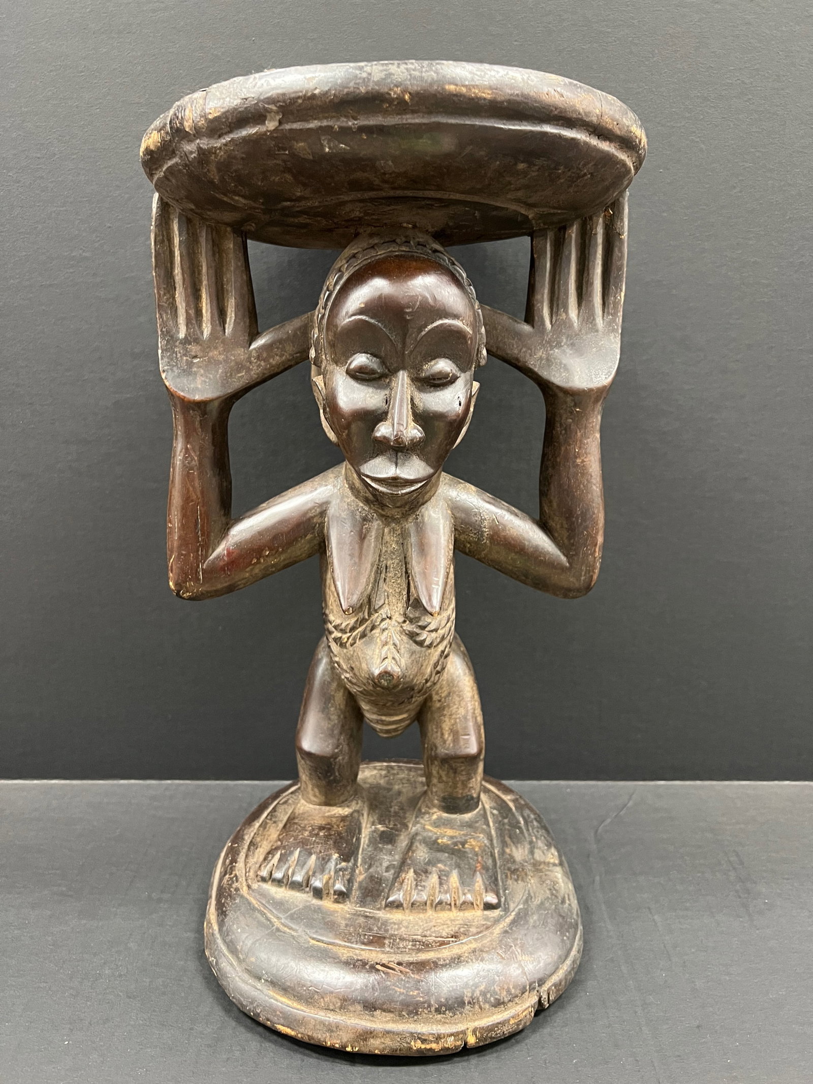 Carved Wood Luba Stool: African Tribal Art Carved Wood Luba Stool Sculpture. The dimension is 19 inches high x 11 inches wide. Please be aware that some of the items are vintage, secondhand, old ages, antiques and may have
